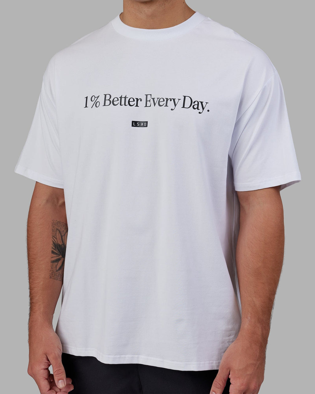 Man wearing Unisex 1% Better FLXCotton Tee Oversize - White