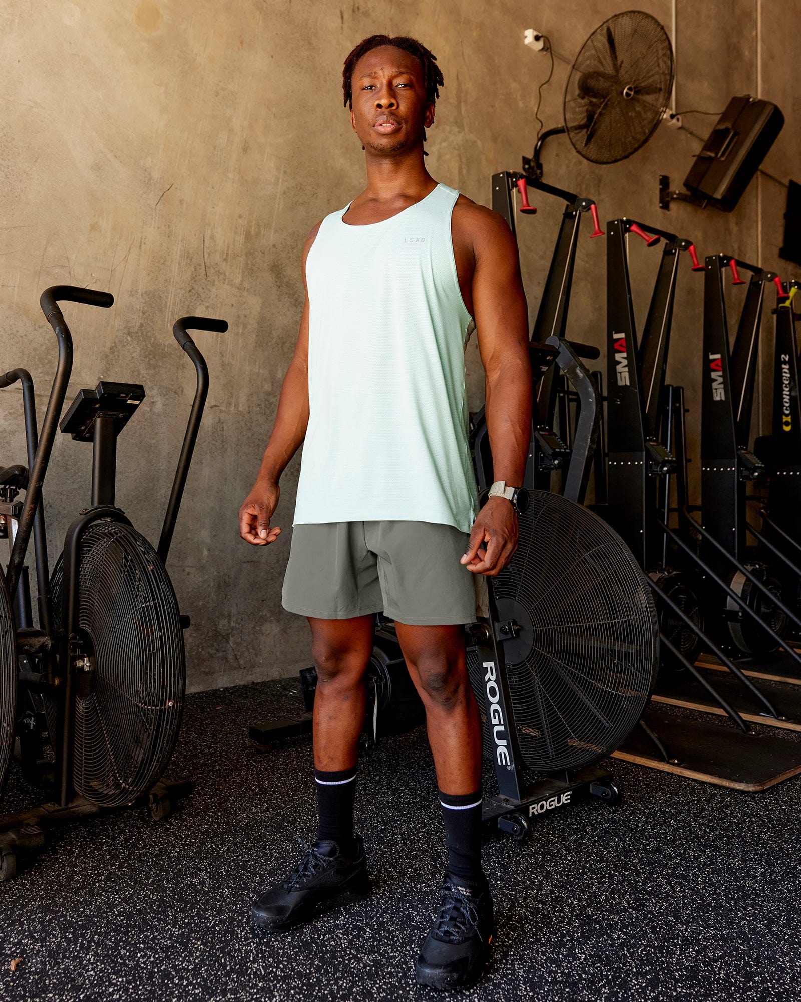 Man wearing Challenger 6" Lined Performance Shorts - Graphite