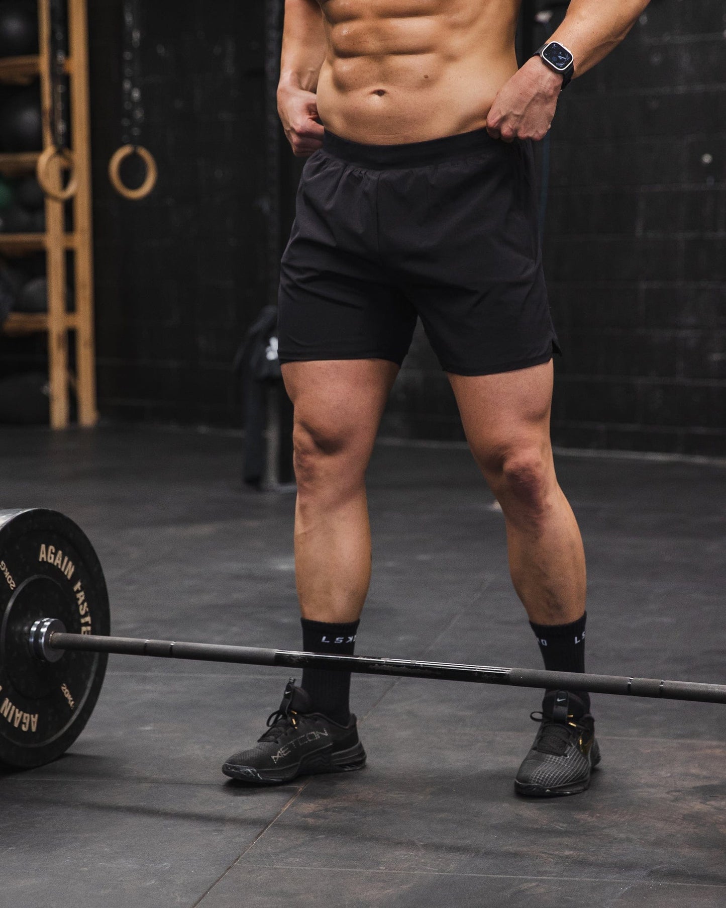Man wearing Challenger 6" Lined Performance Short - Black