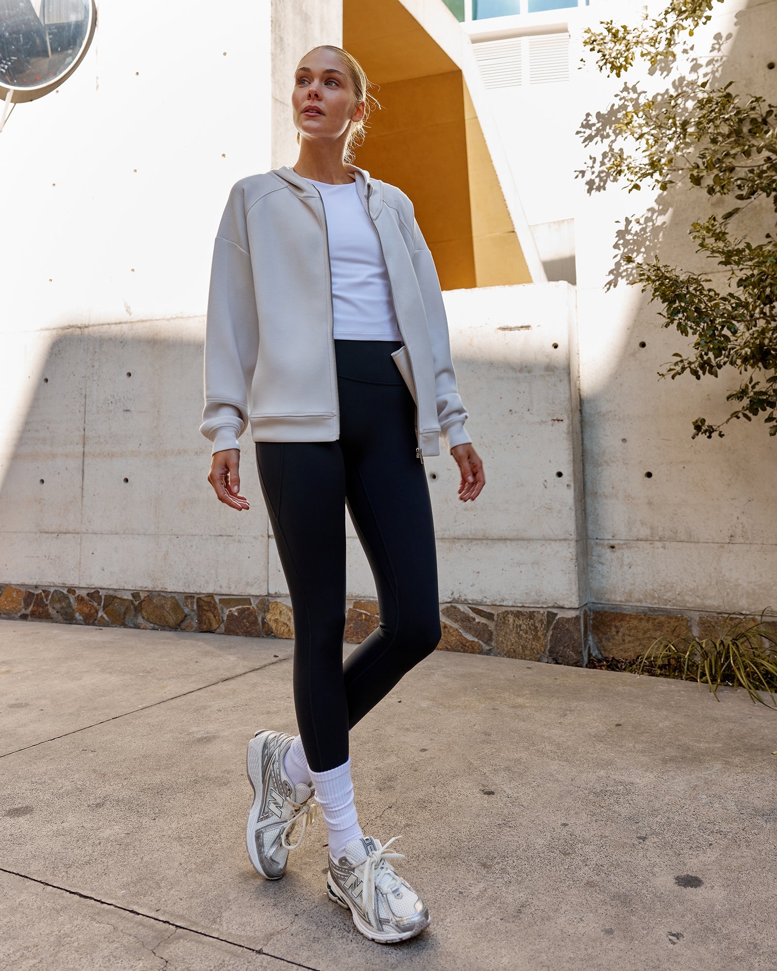 Woman wearing Elevate SoftTouch Zip Through Hoodie - Clay-Clay