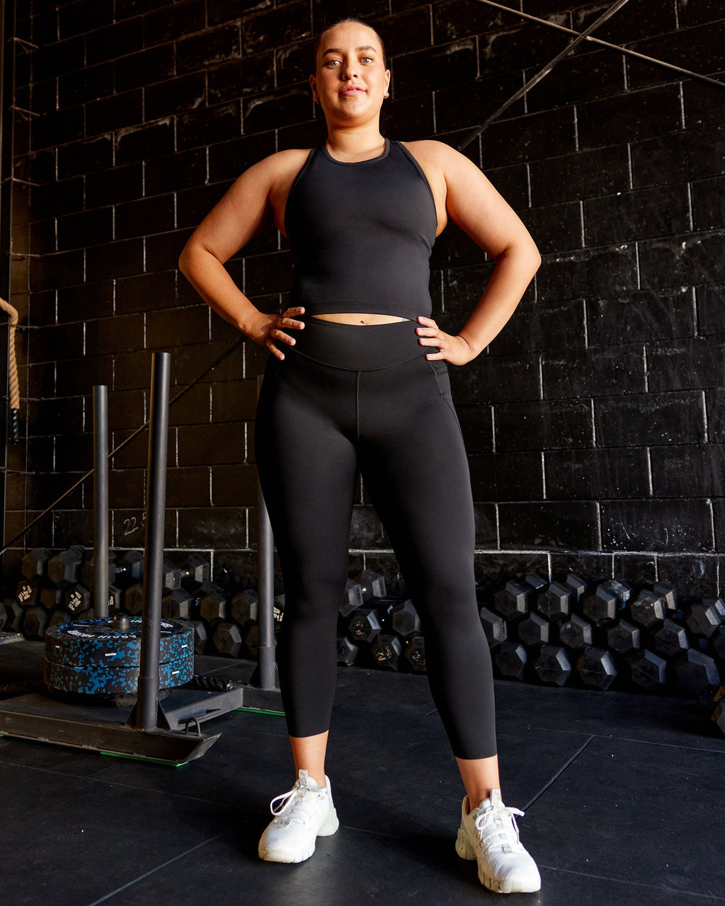 Woman wearing Elite 7/8 Length Leggings - Black