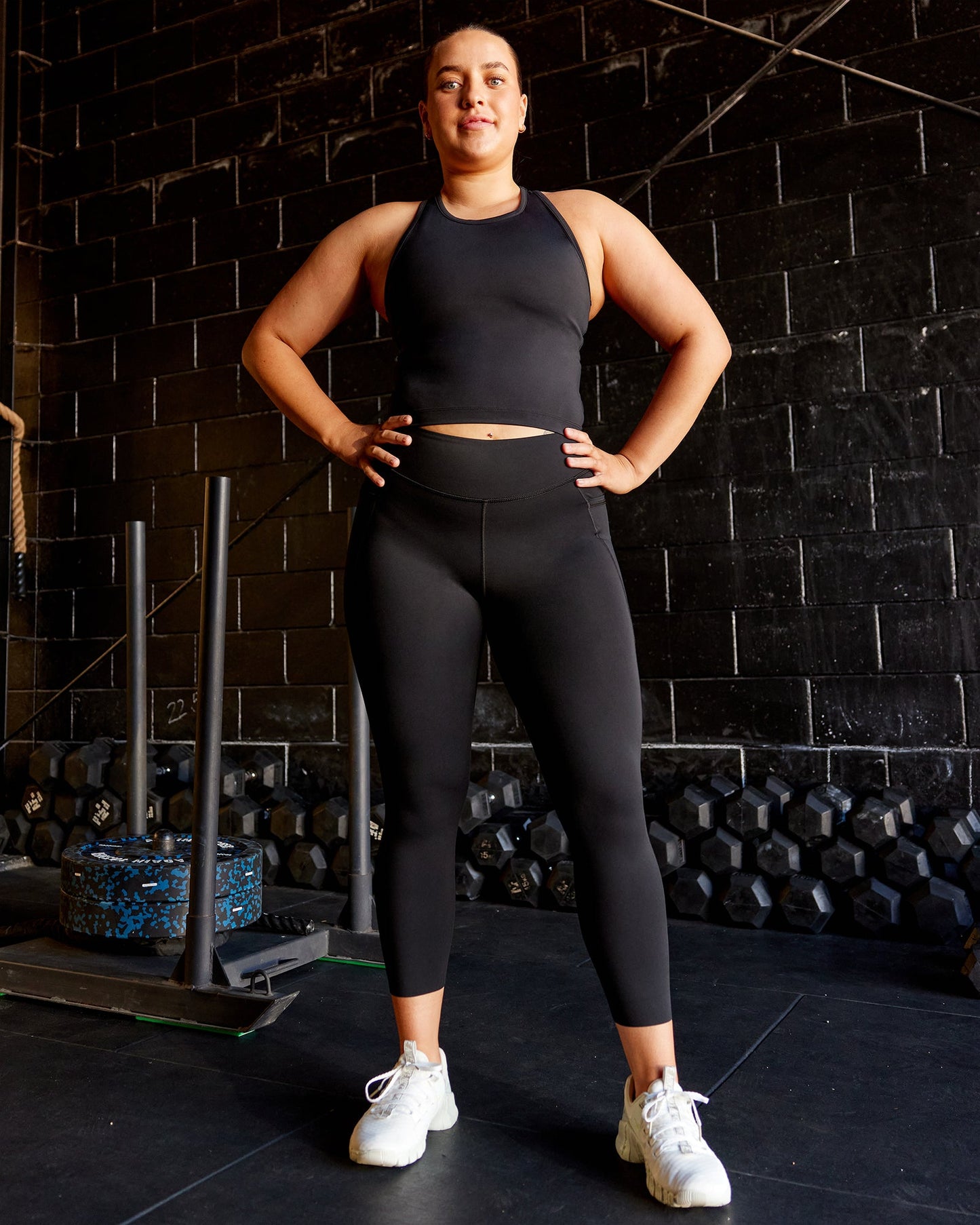 Woman wearing Elite 7/8 Length Leggings - Black