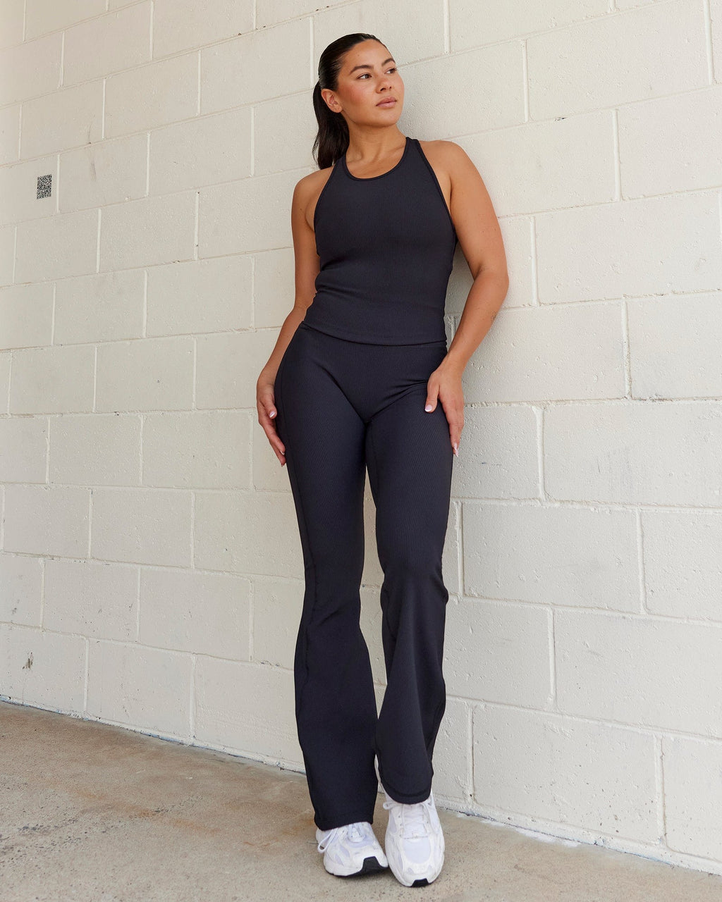 Woman wearing Flow Ribbed Shelf Bra Tank - Black
