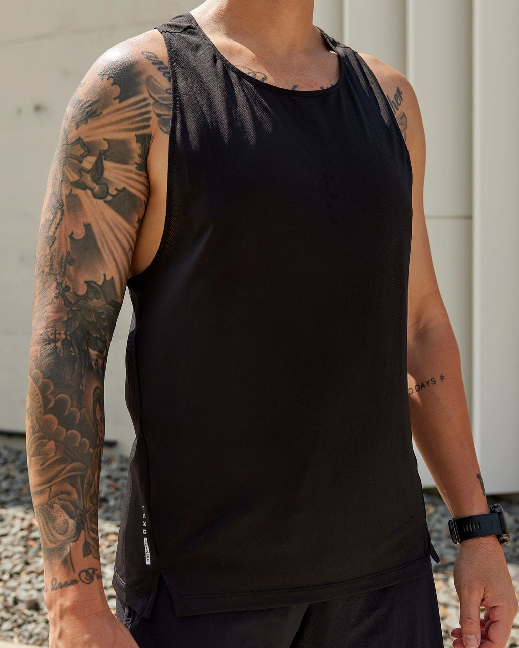 Man wearing Pace Running Tank - Black