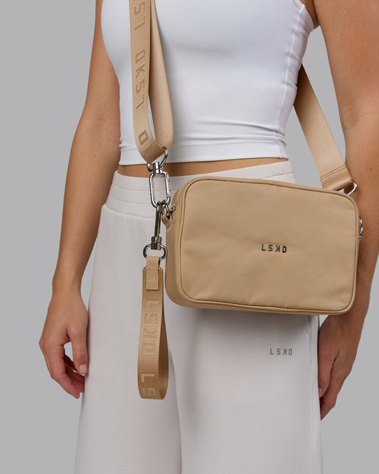 Woman wearing Go-To Shoulder Bag - Oat Milk