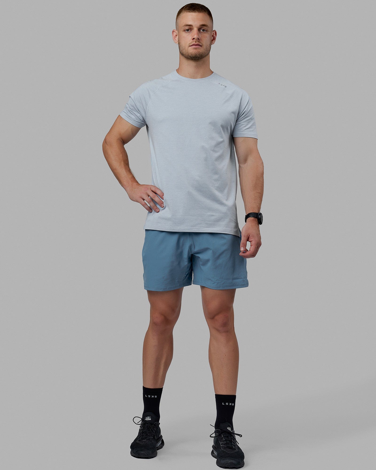 Man wearing Challenger 6" Lined Performance Shorts - Elemental Blue
