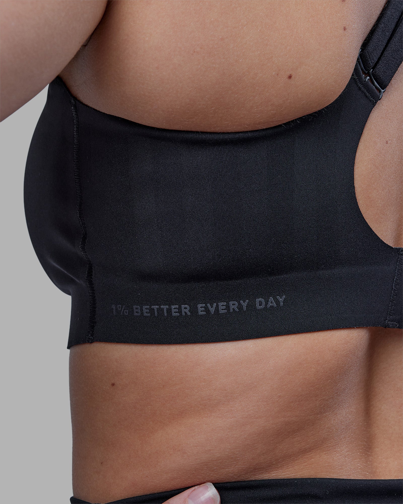 Woman wearing Stability Sports Bra - Black | Model:Amy | Size:M (D-E Cup)