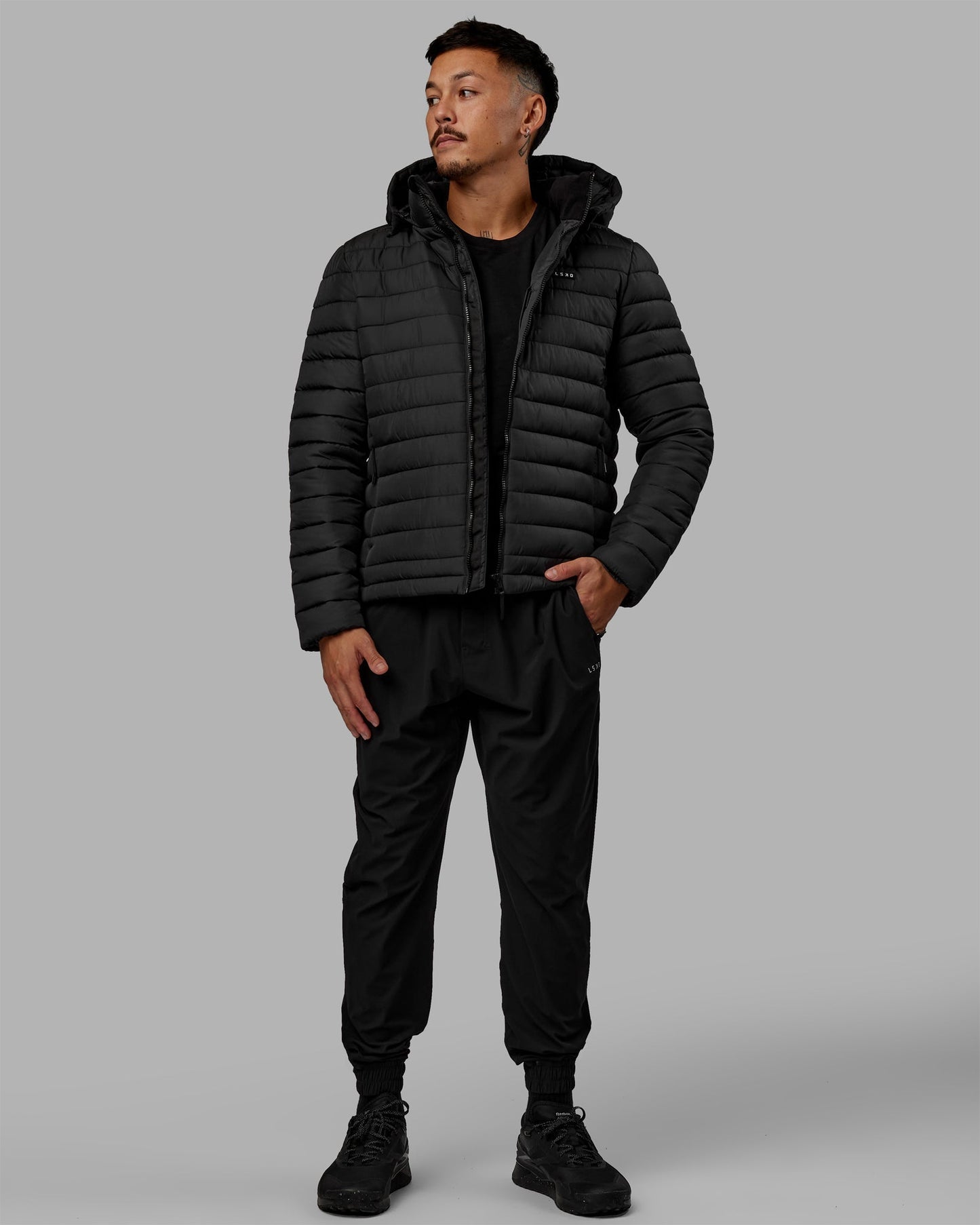 Man wearing All-day Puffer Jacket - Black