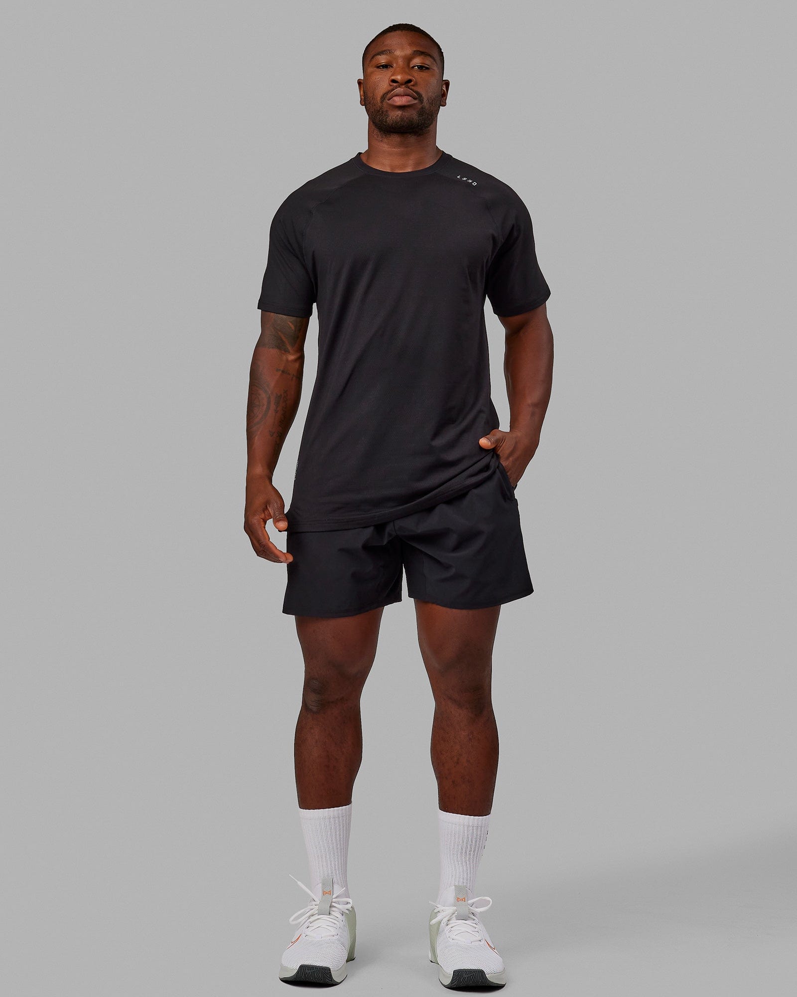 Man wearing Perform VapourFLX Tee - Black-Reflective