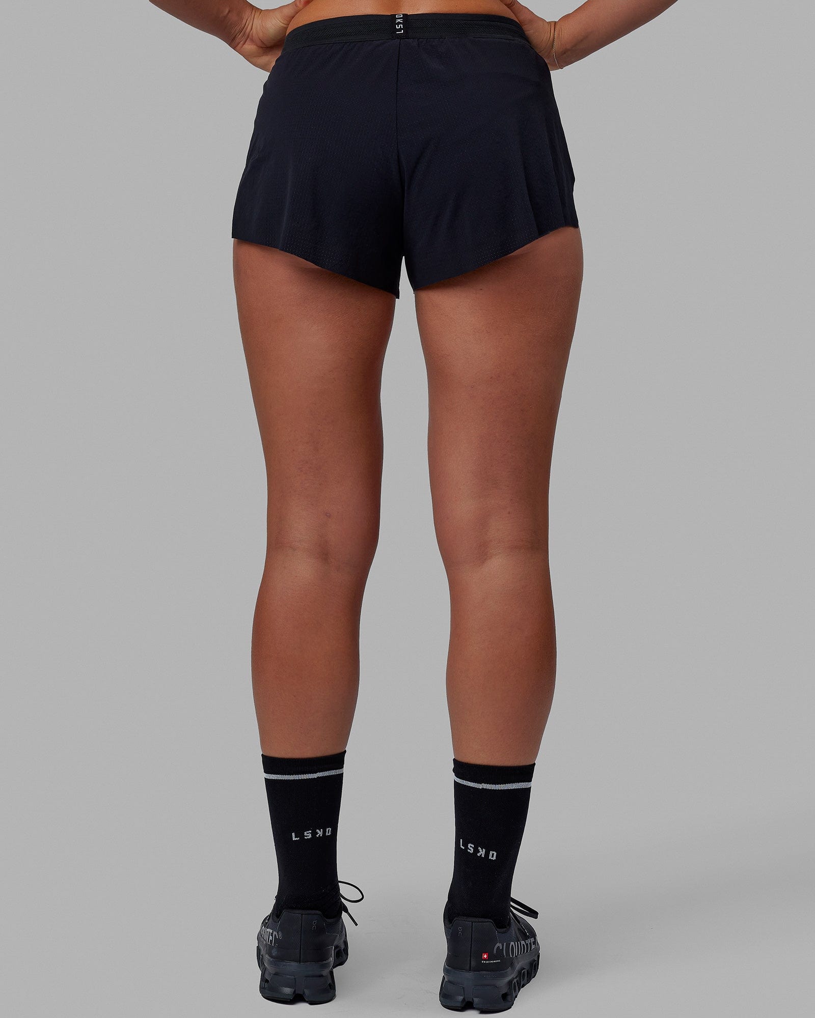Woman wearing Accelerate Run Shorts - Black