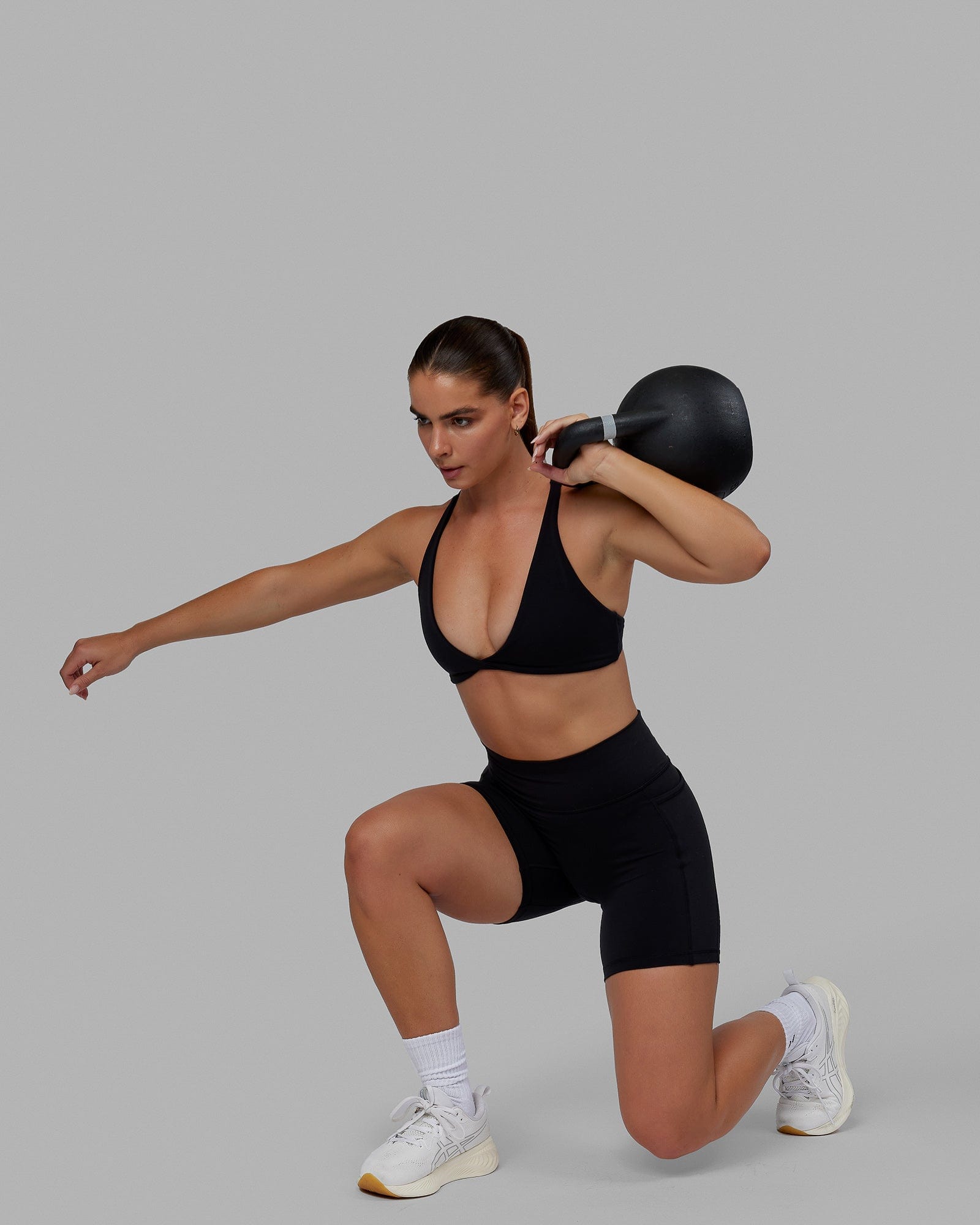 Woman wearing Agile Sports Bra - Black