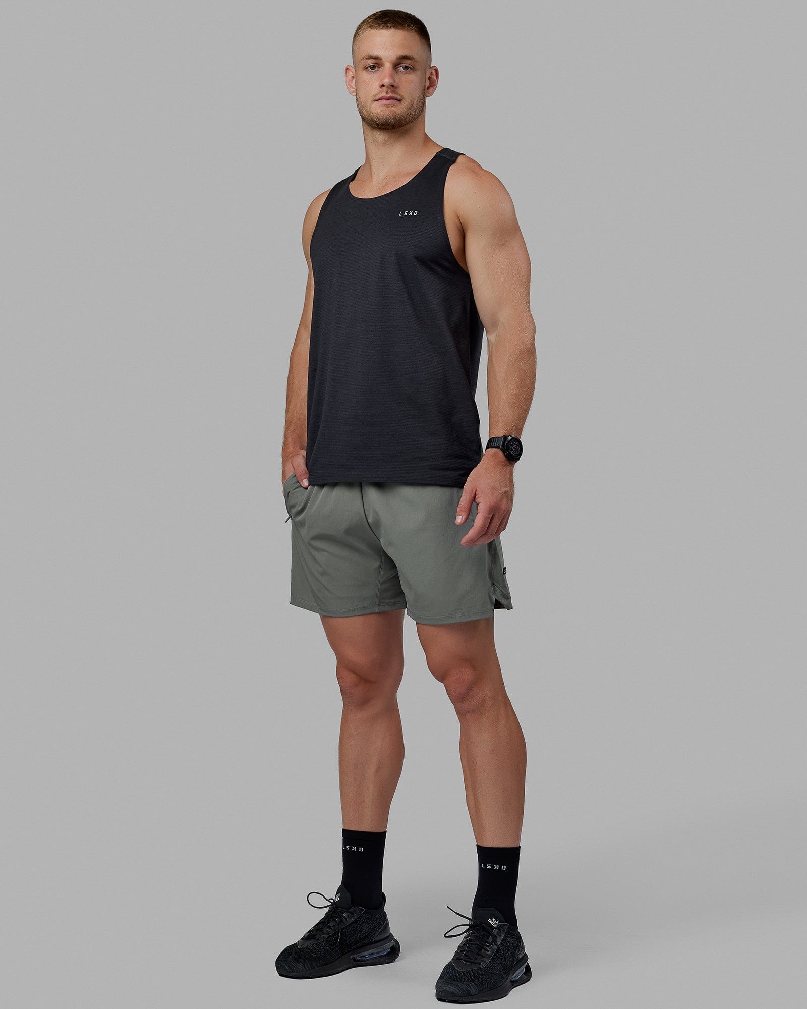 Man wearing Challenger 6" Lined Performance Shorts - Graphite