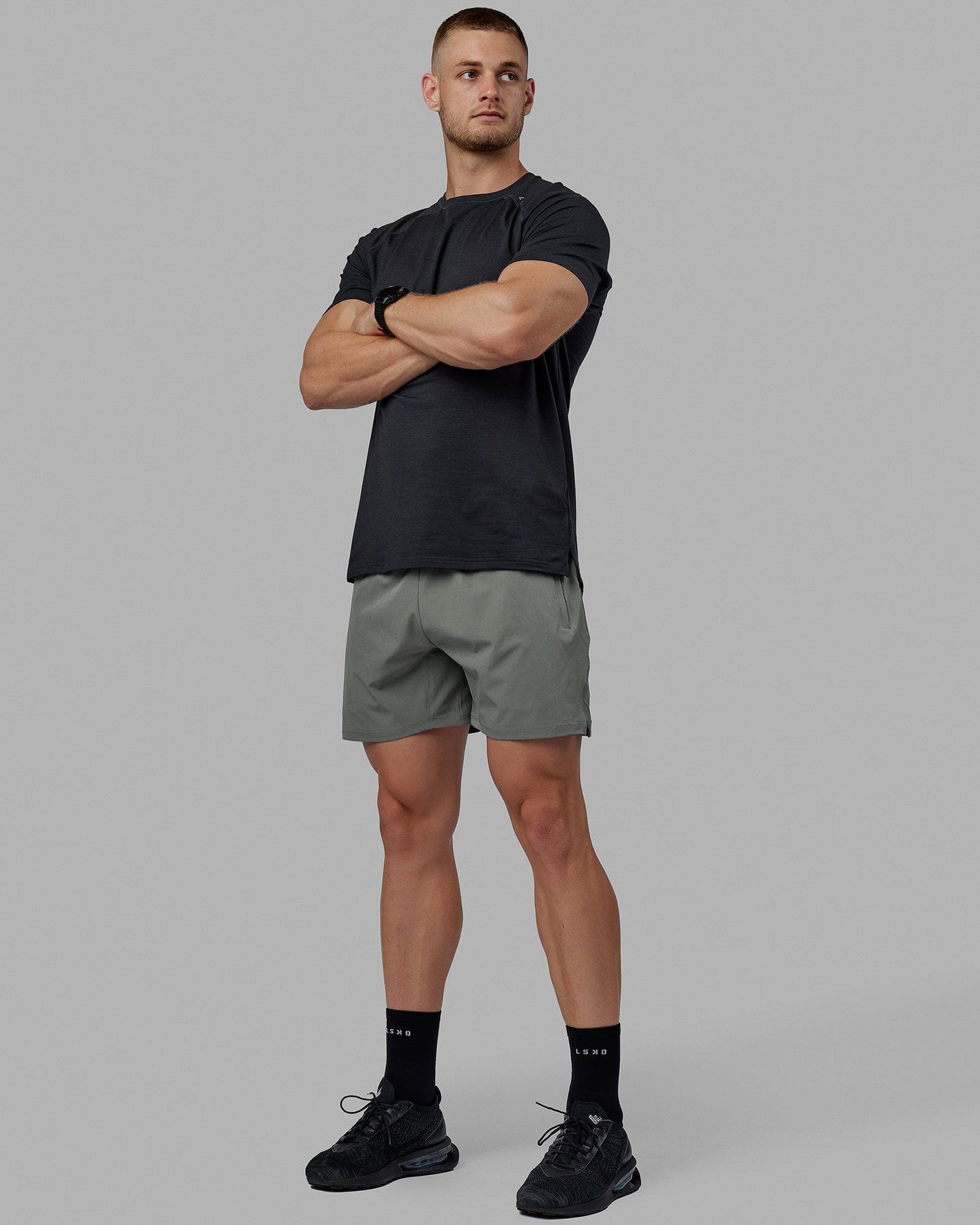 Man wearing Challenger 6" Performance Shorts - Graphite