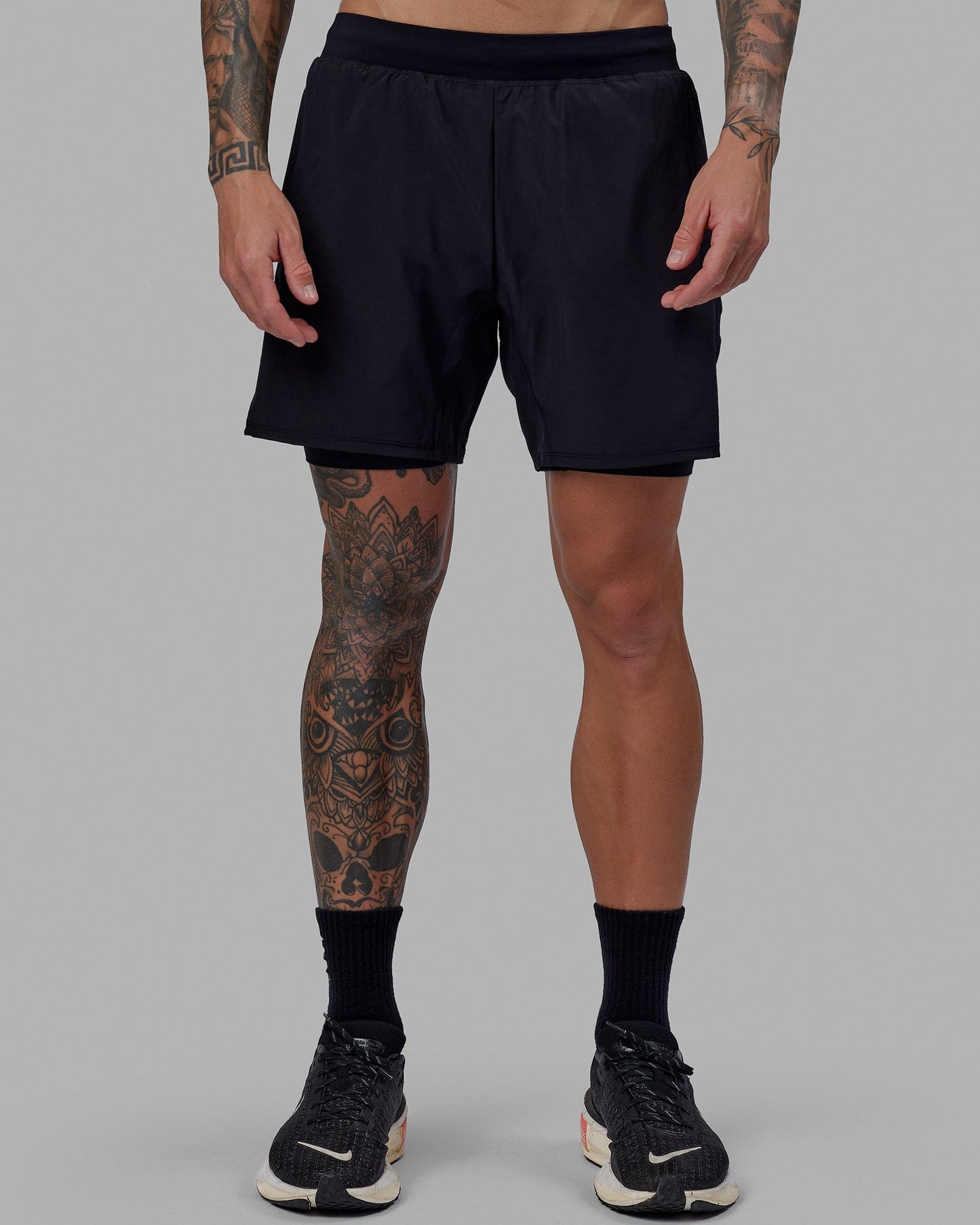 Man wearing Challenger 6" Lined Performance Short - Black