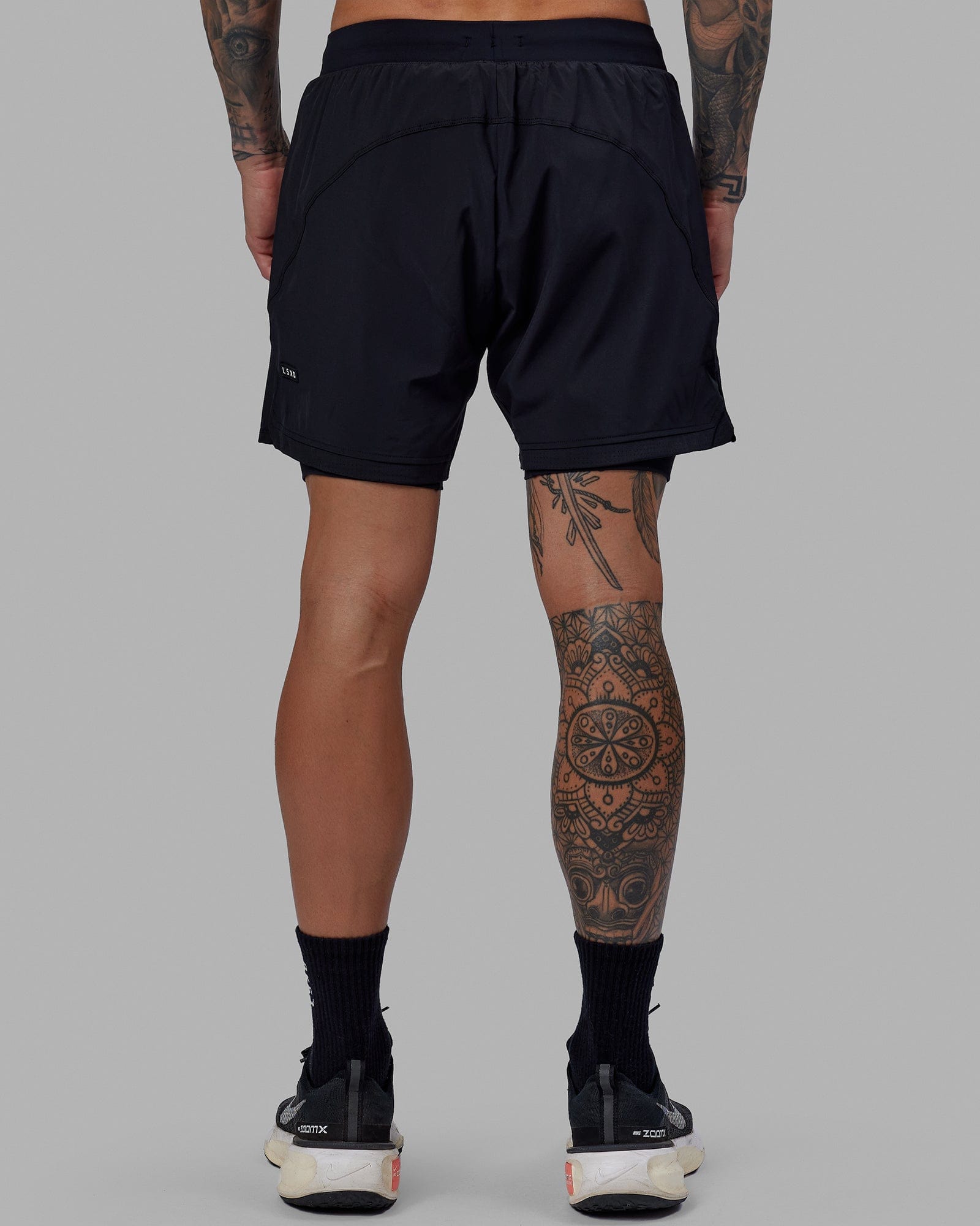 Man wearing Challenger 6" Lined Performance Short - Black