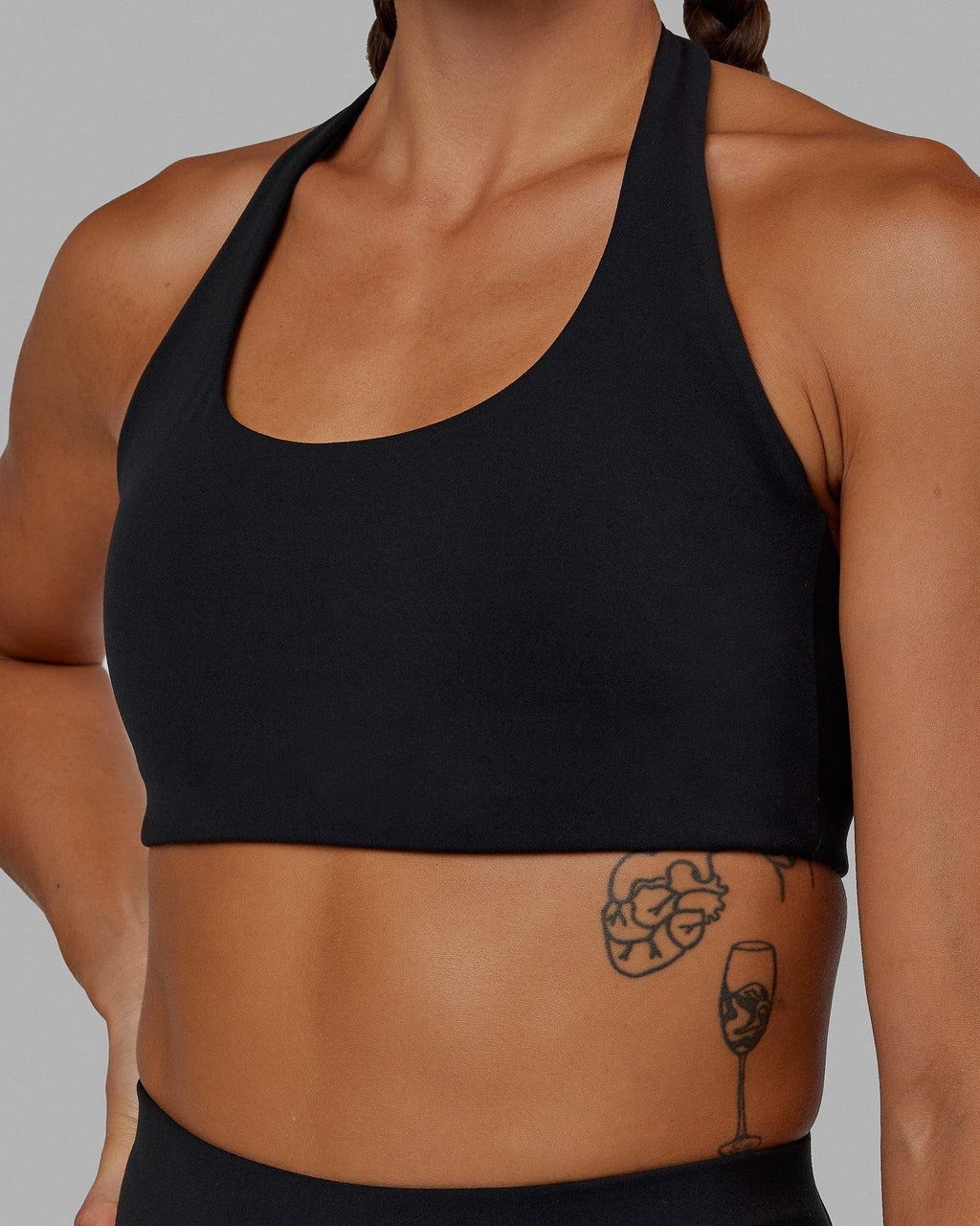 Woman wearing Challenger Sports Bra - Black
