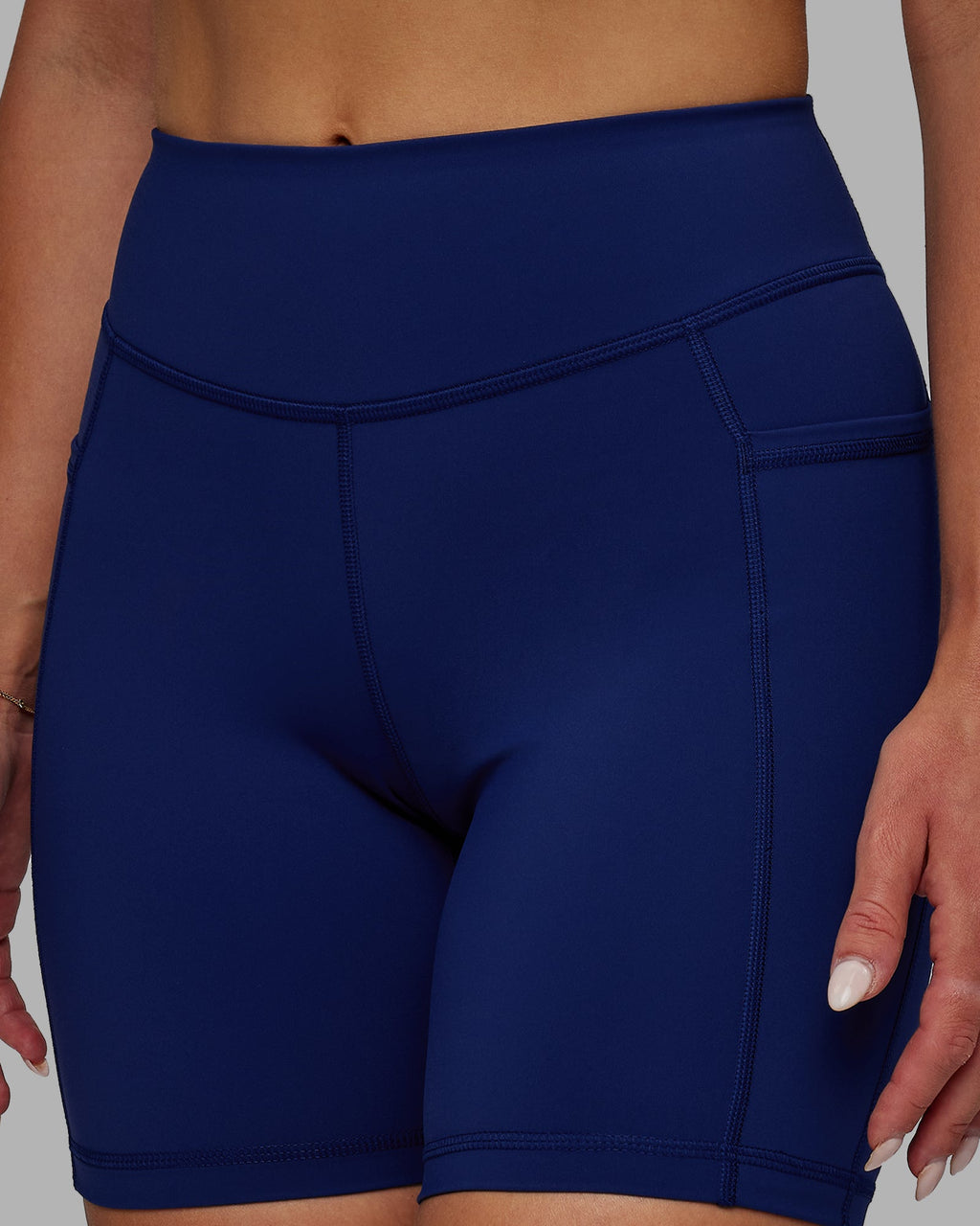 Woman wearing Elite Mid-Length Shorts - Midnight Blue