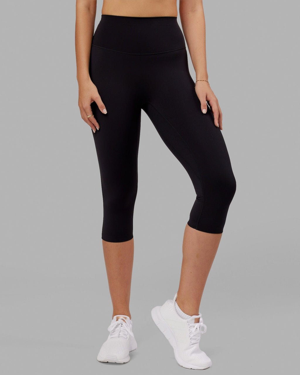 Woman wearing Elixir 3/4 Length Tight - Black No Logo