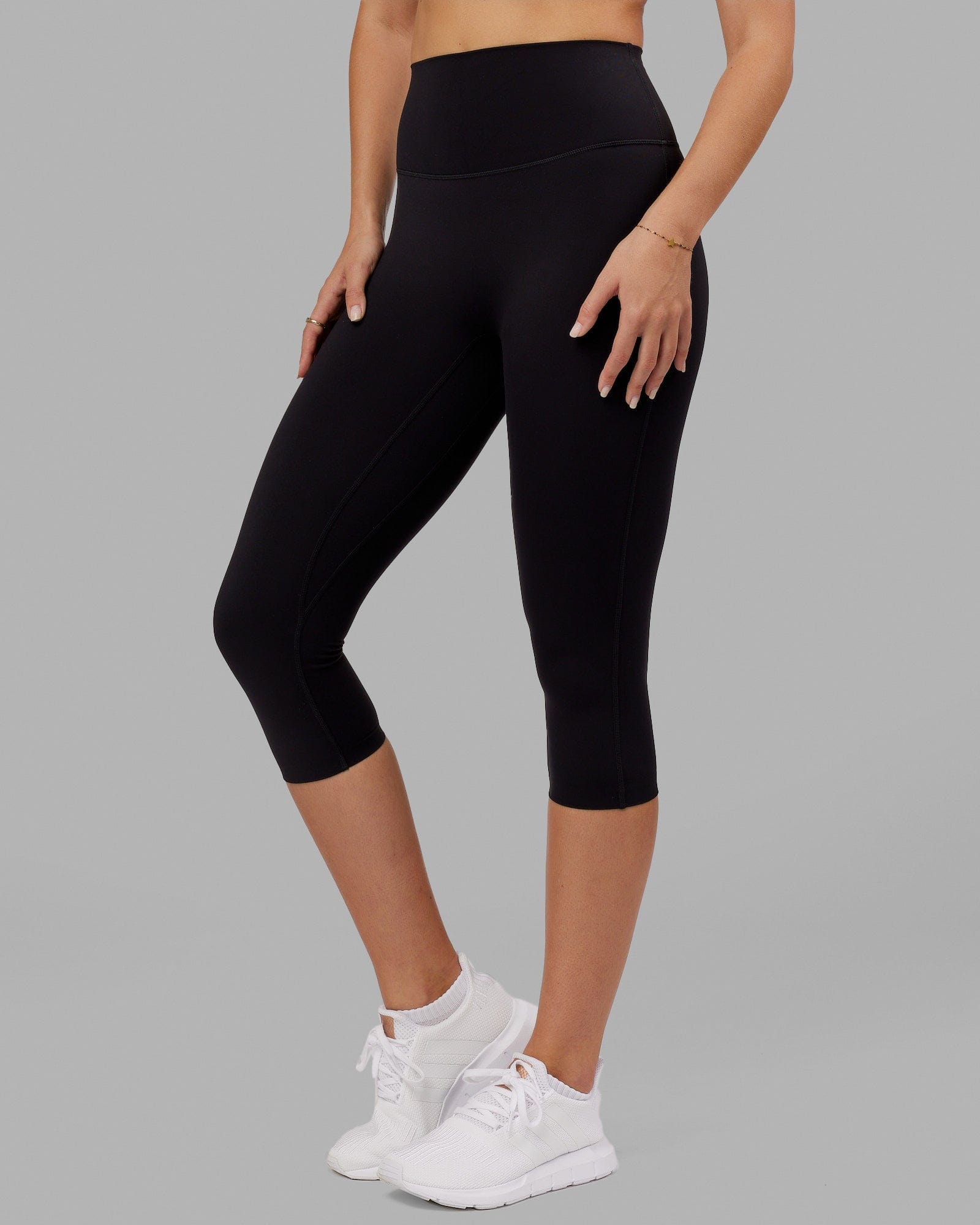 Woman wearing Elixir 3/4 Length Tight - Black No Logo