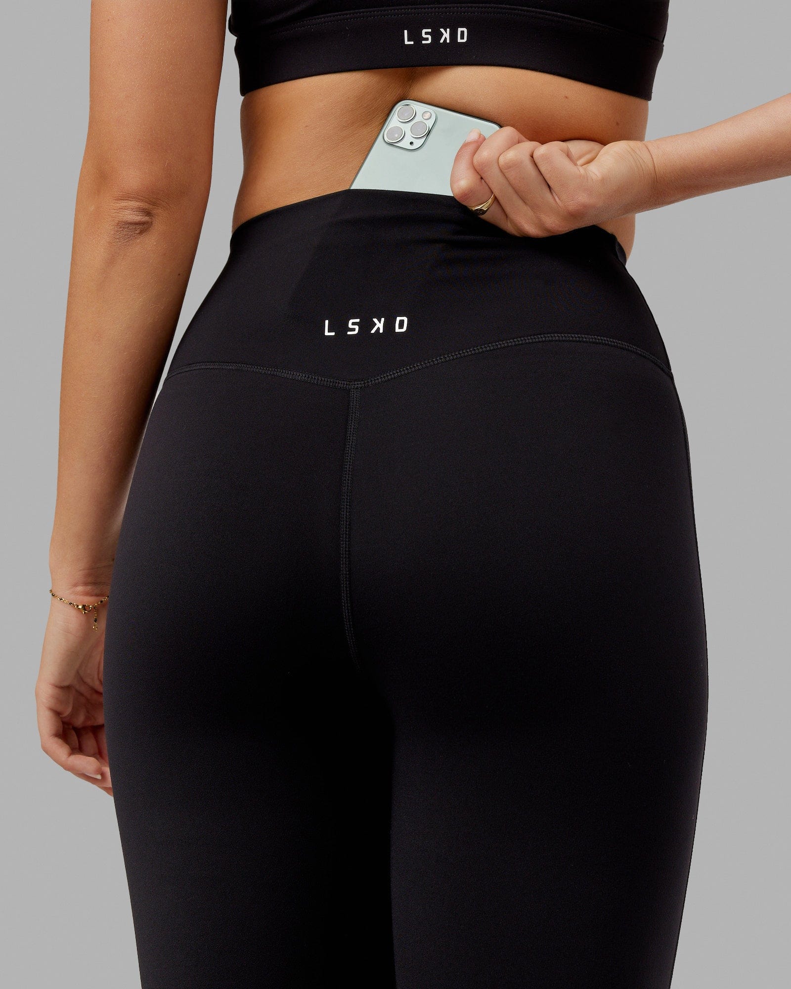 Woman wearing Elixir 3/4 Length Tight - Black No Logo