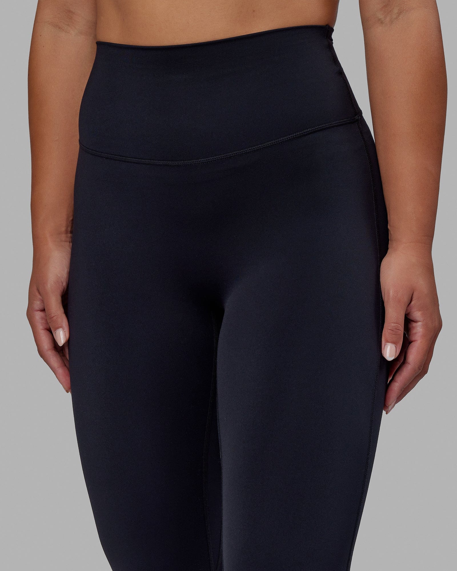 Woman wearing Elixir 7/8 Length Tight - Black No Logo