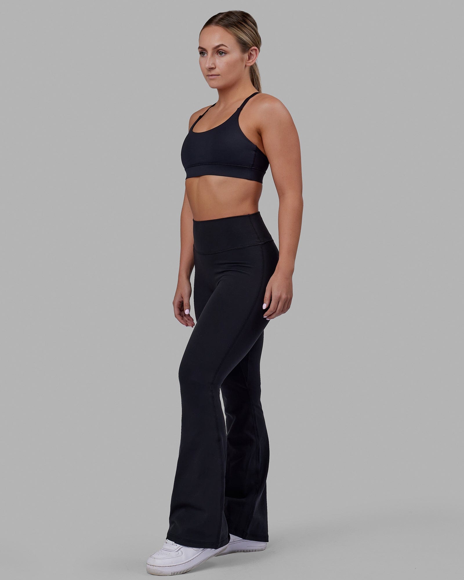 Woman wearing Everyday Flare Tight Petite - Black