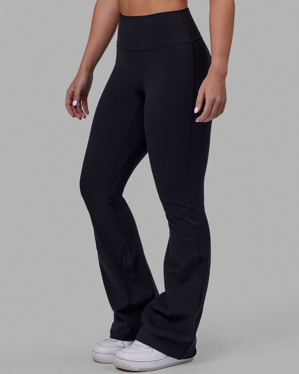 Woman wearing Everyday Flare Tight Petite - Black