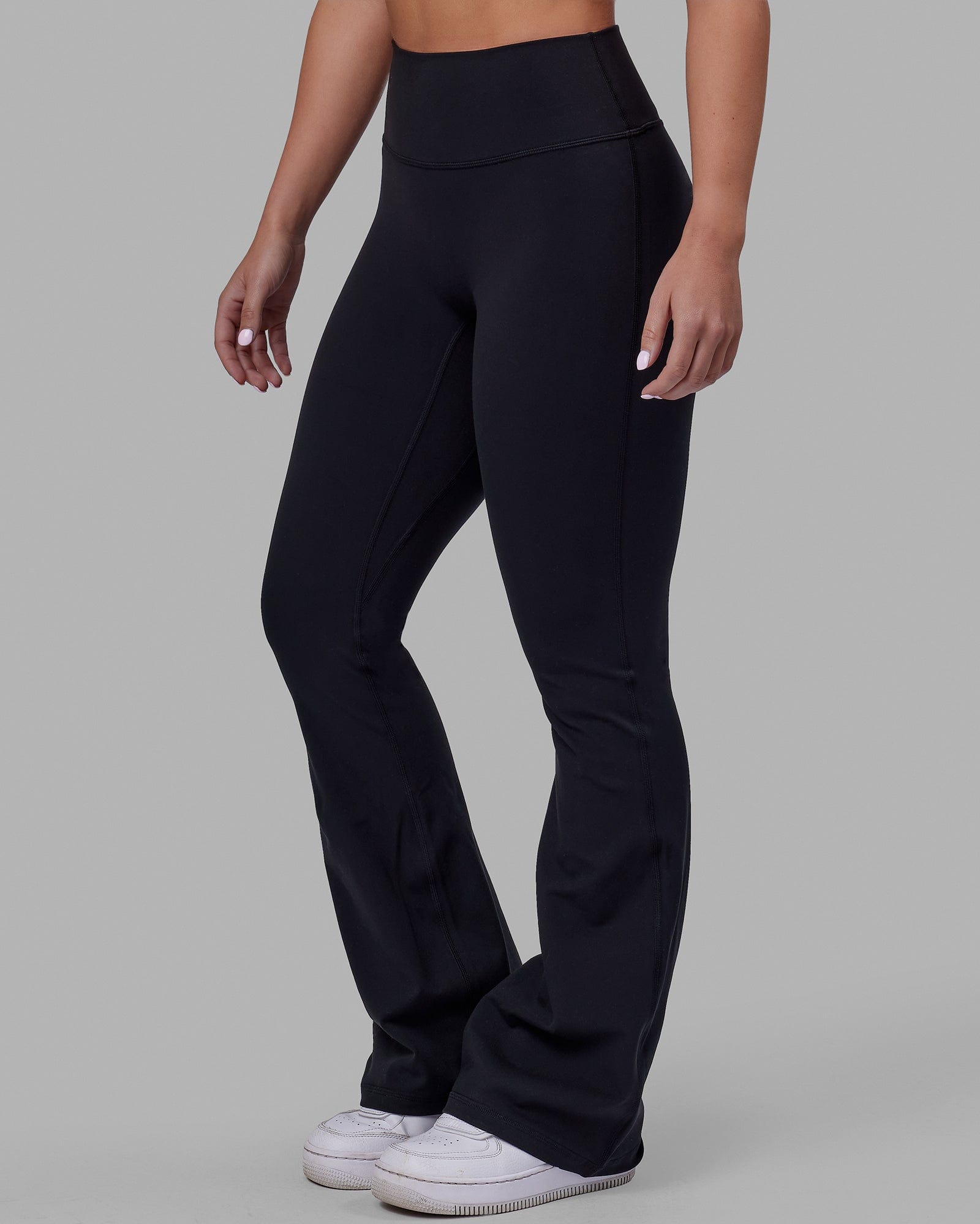 Woman wearing Everyday Flare Tight Petite - Black