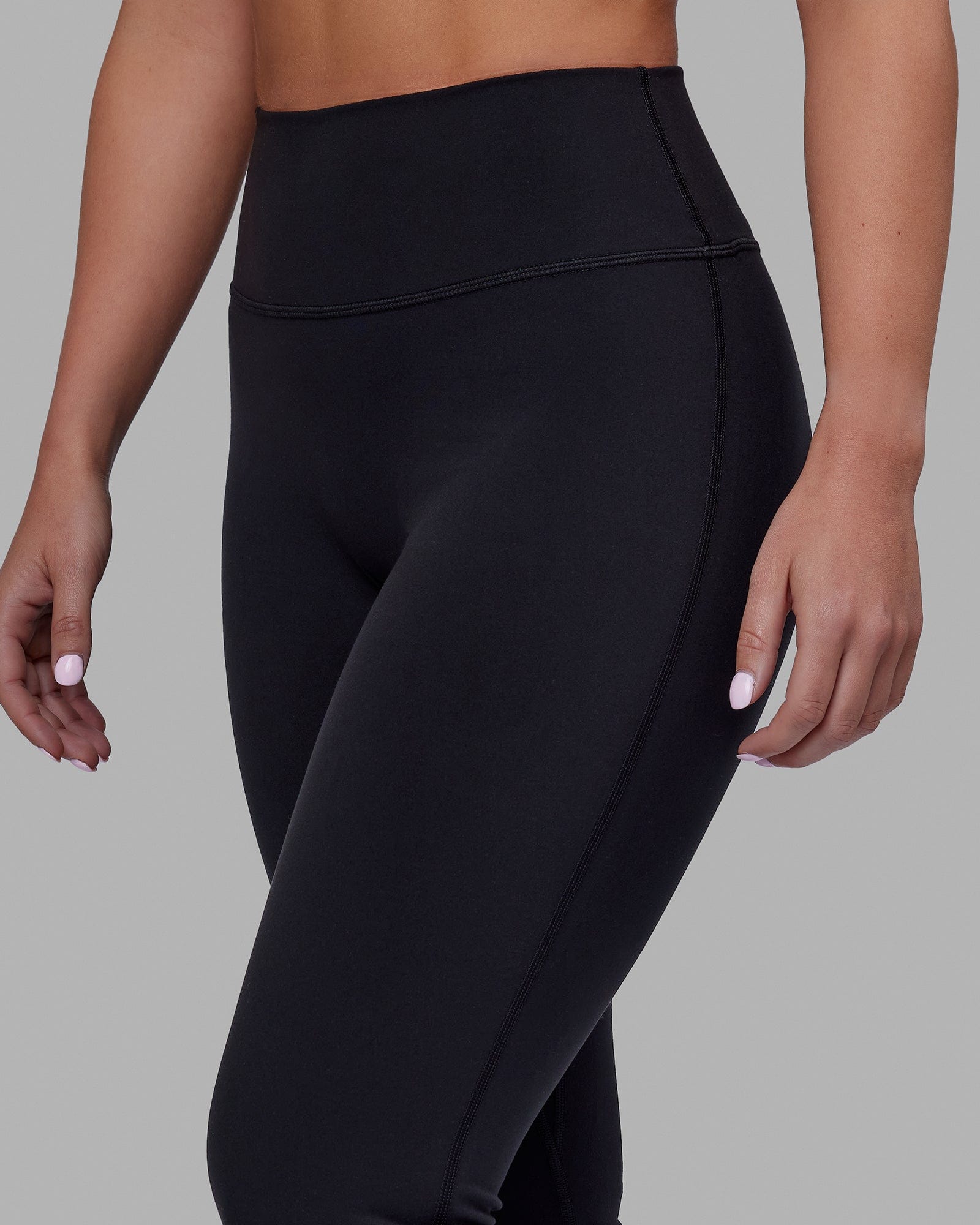 Woman wearing Everyday Flare Tight Petite - Black