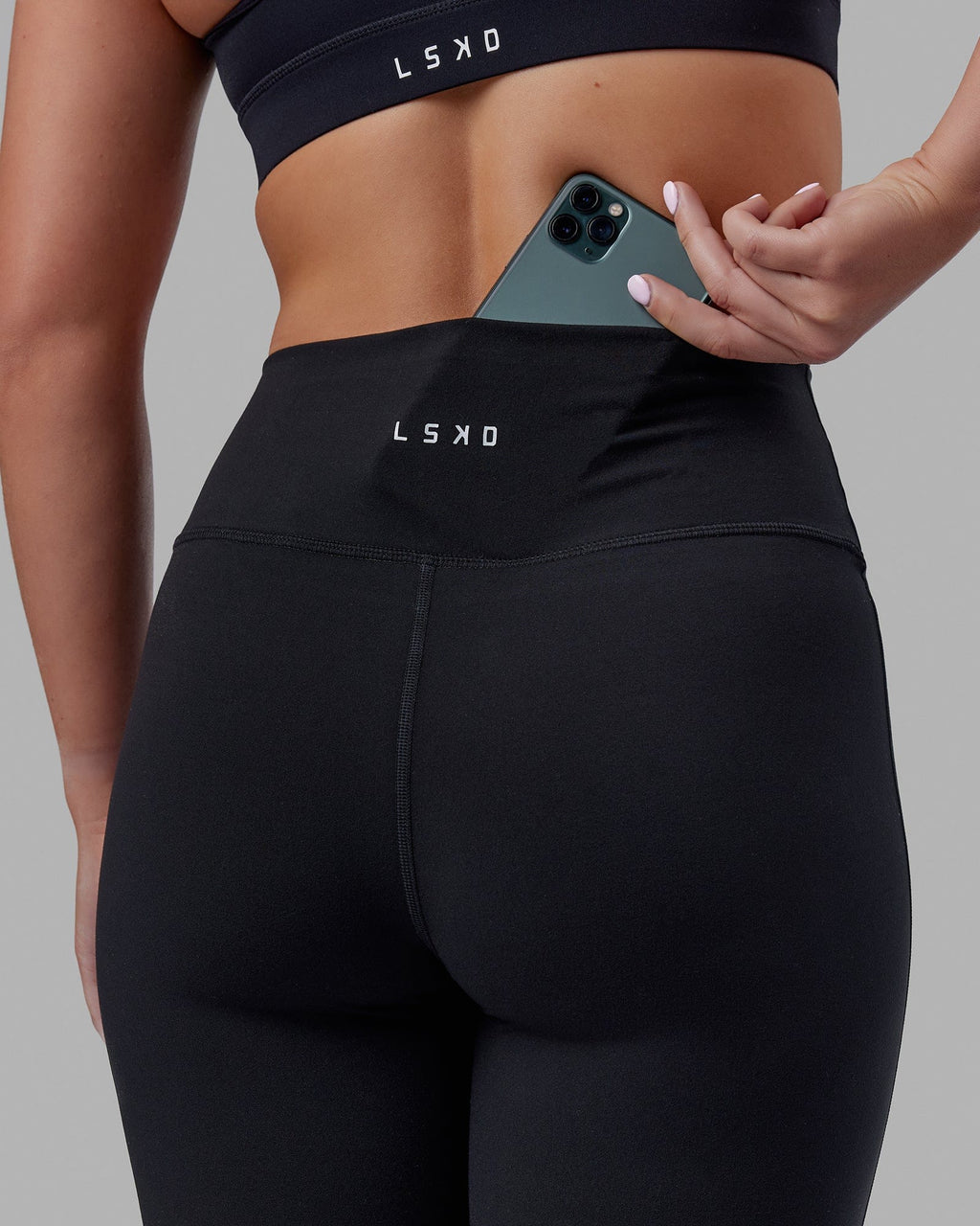 Woman wearing Everyday Flare Tight Petite - Black