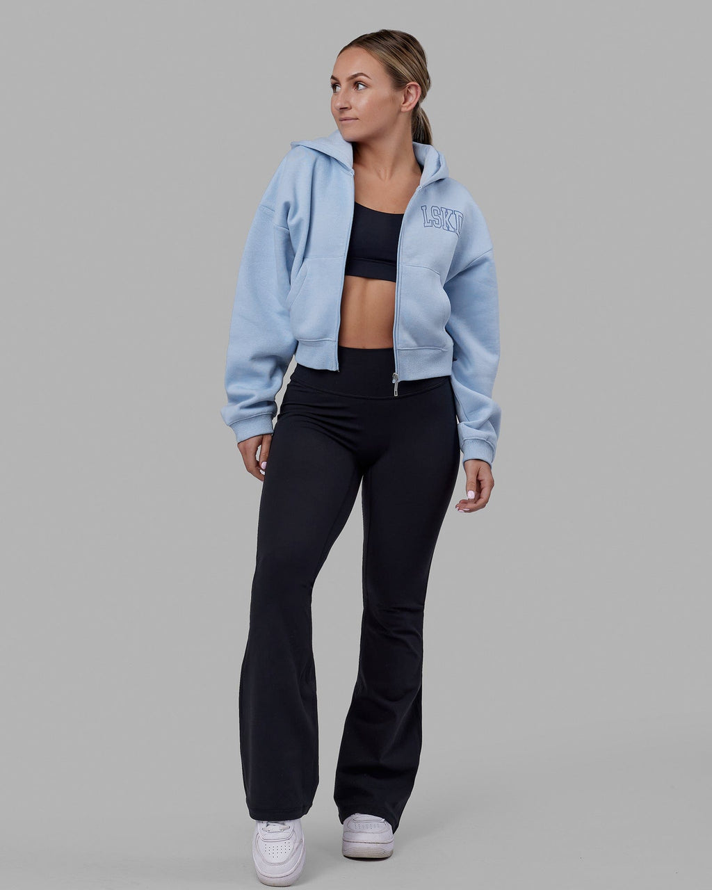 Woman wearing Everyday Flare Tight Petite - Black