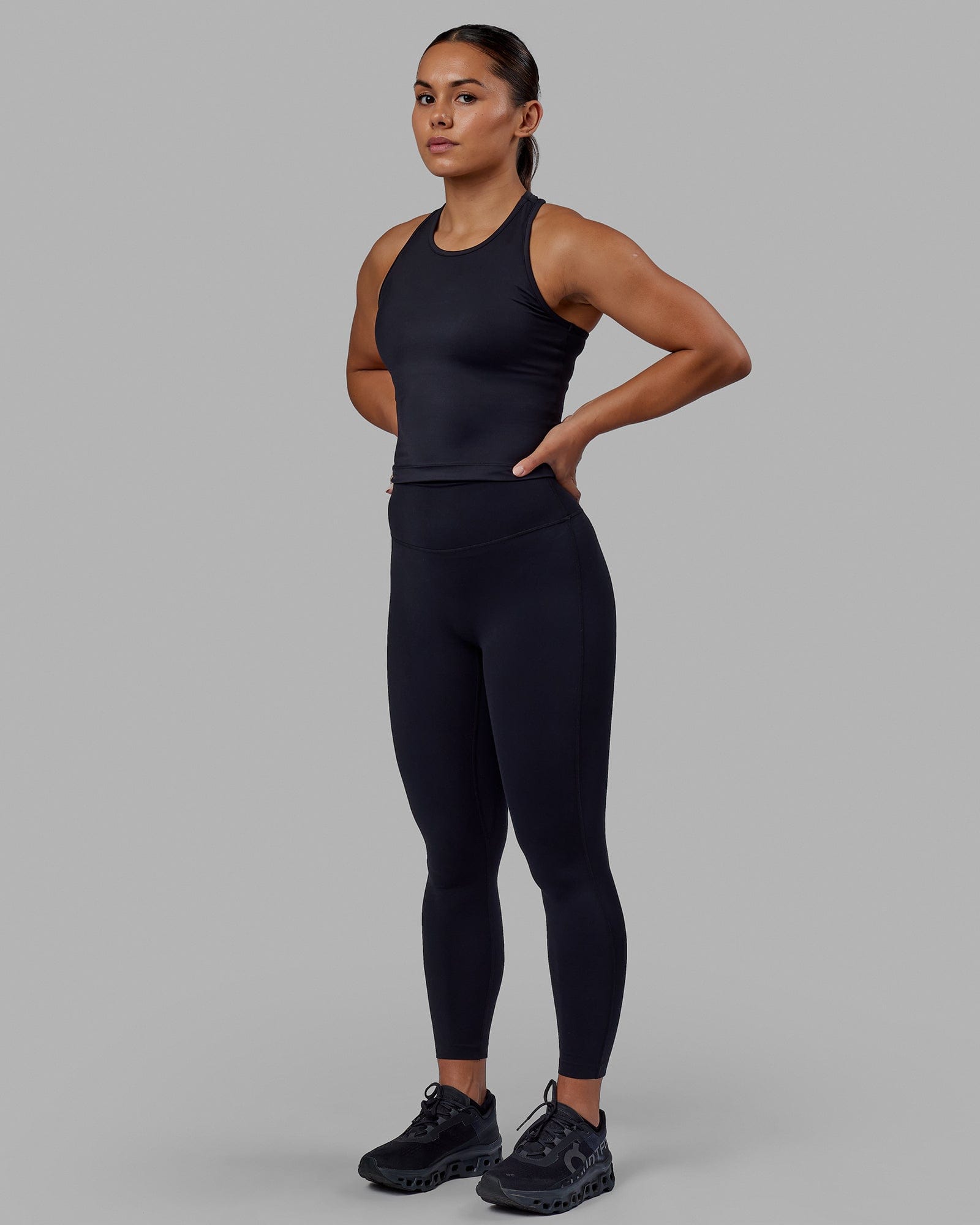 Woman wearing Flow Performance Tank - Black