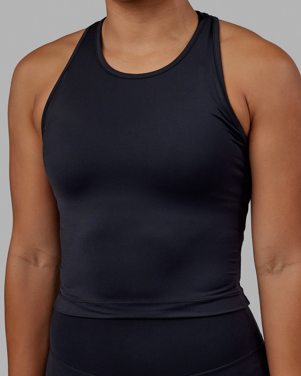 Woman wearing Flow Performance Tank - Black