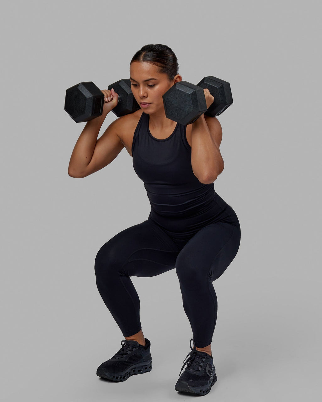 Woman wearing Flow Performance Tank - Black