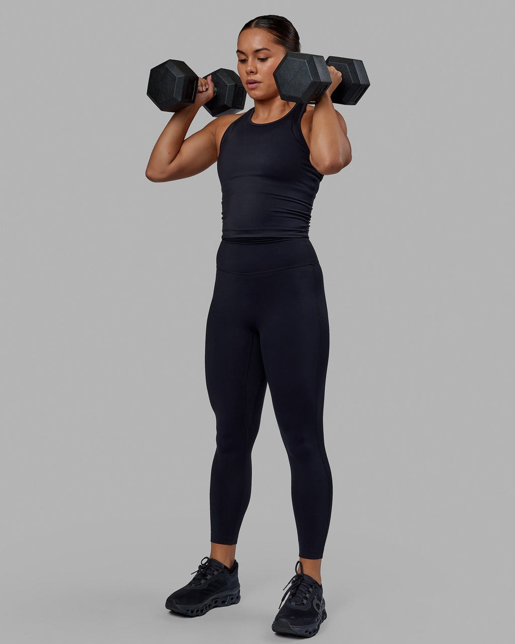 Woman wearing Flow Performance Tank - Black
