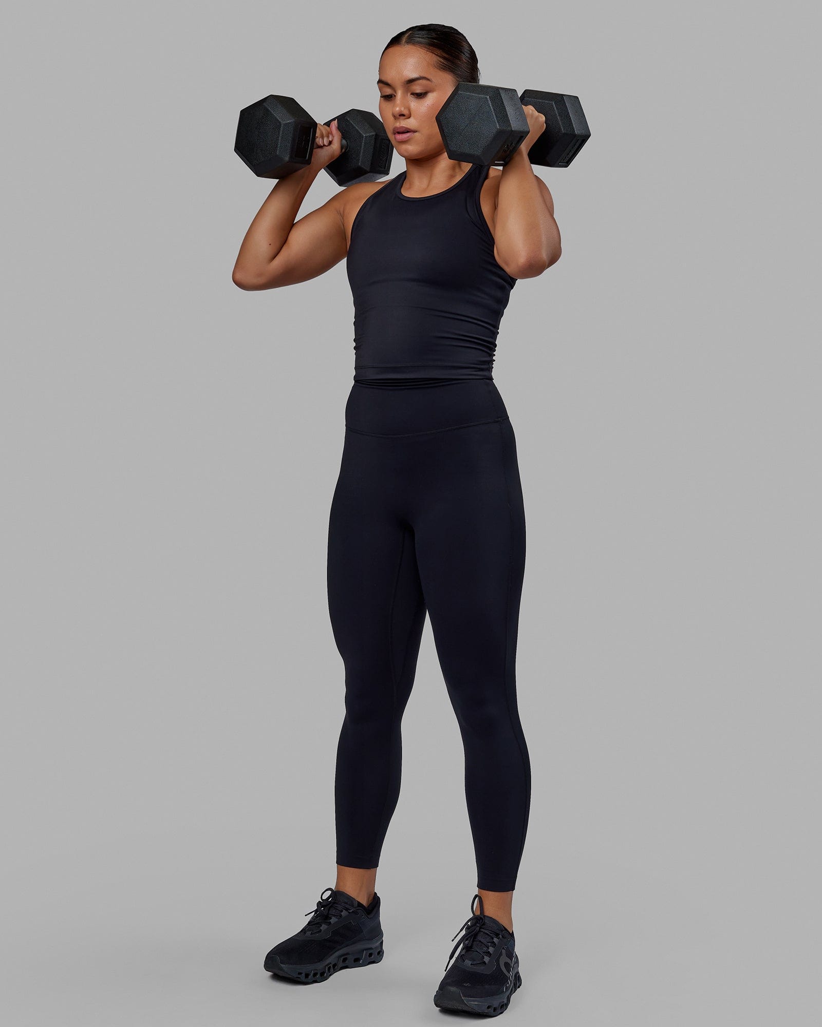 Woman wearing Flow Performance Tank - Black