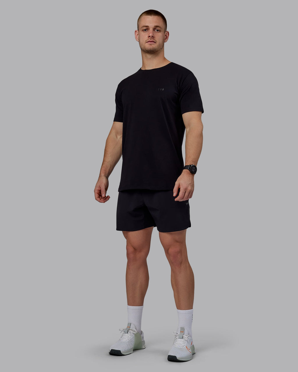 Man wearing Lift 6" Performance Shorts - Black-Reflective