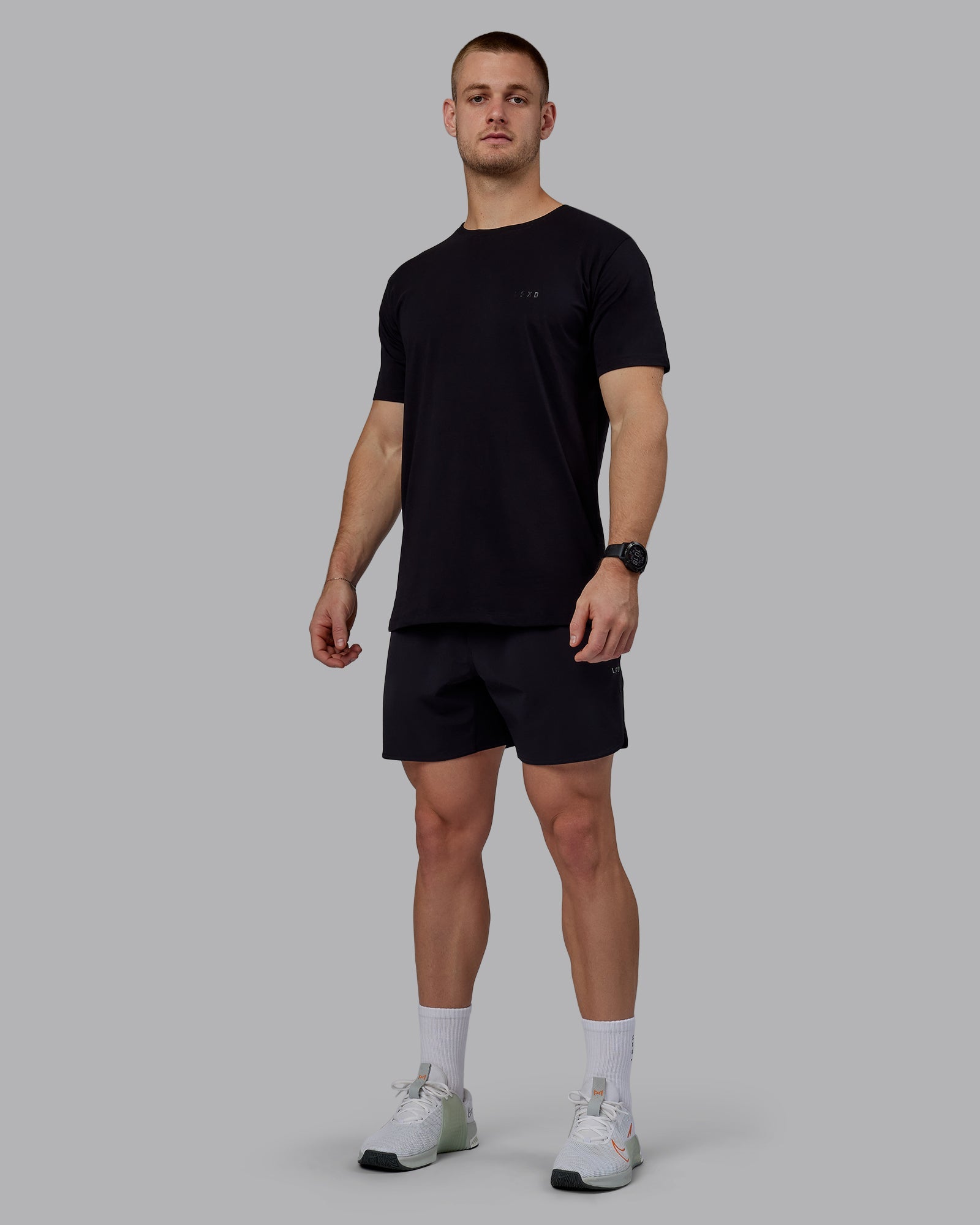 Man wearing Lift 6" Performance Shorts - Black-Reflective