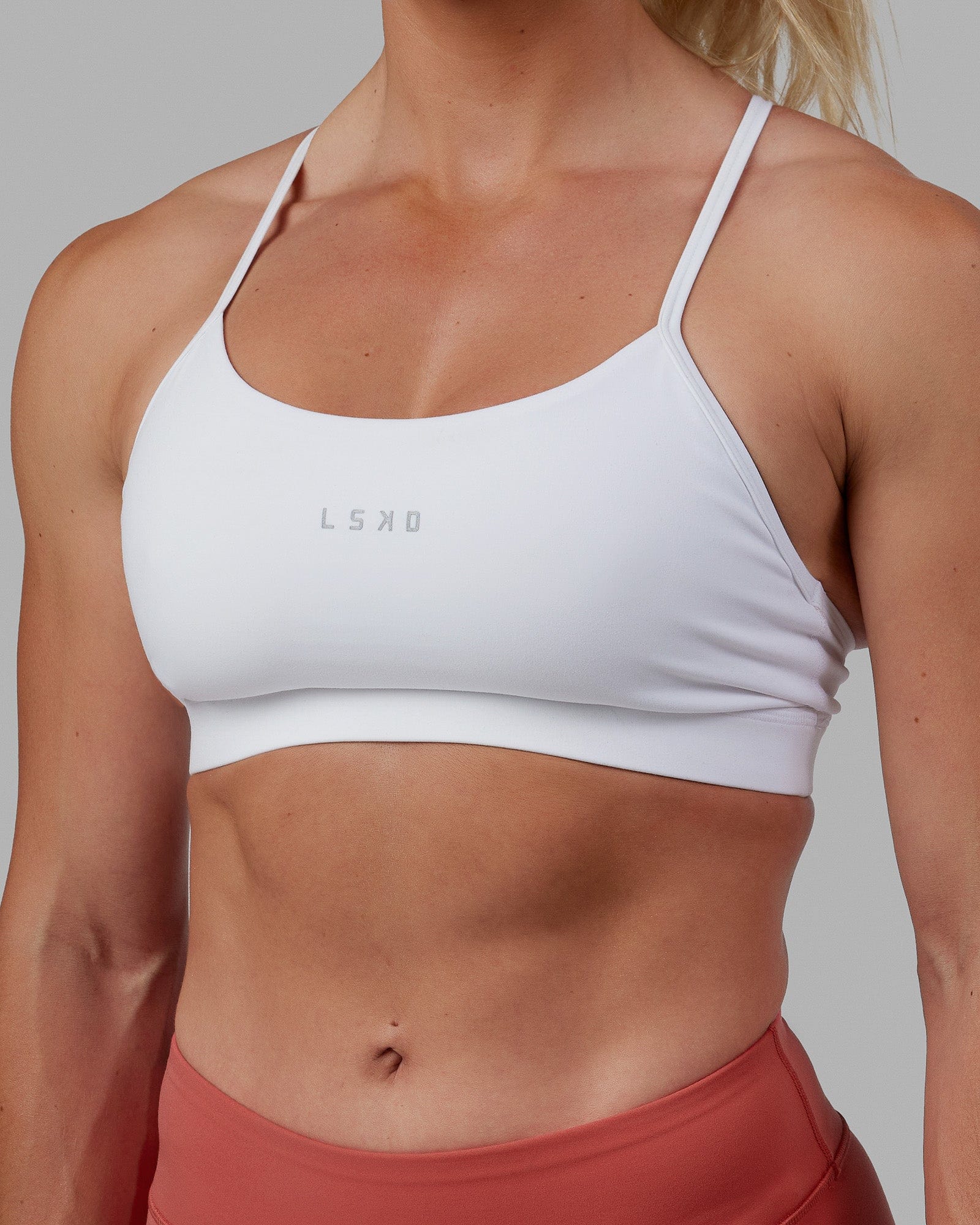 Woman wearing Lift Sports Bra - White
