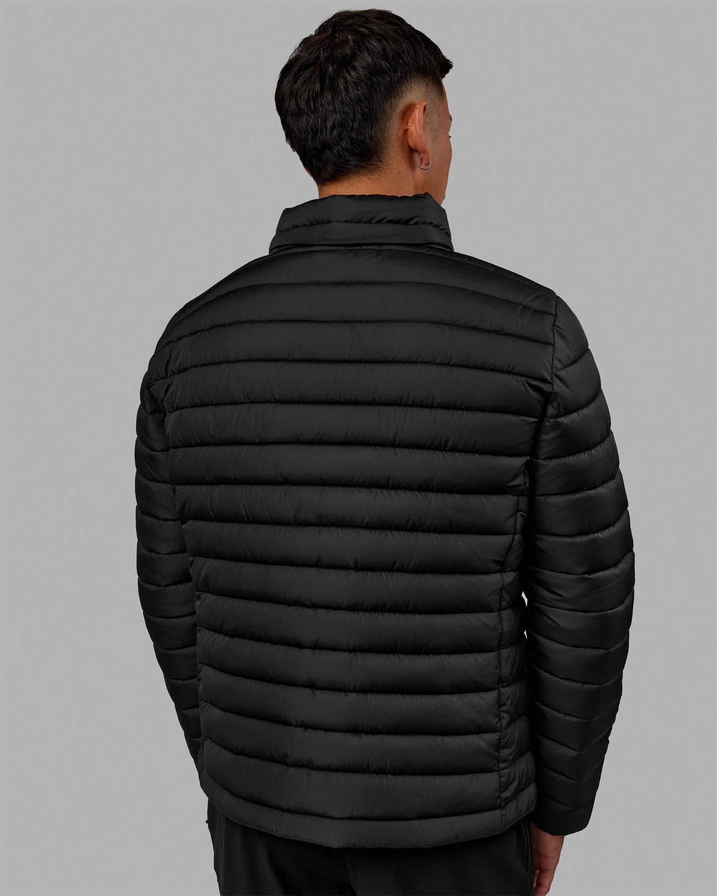 Man wearing All-day Puffer Jacket - Black