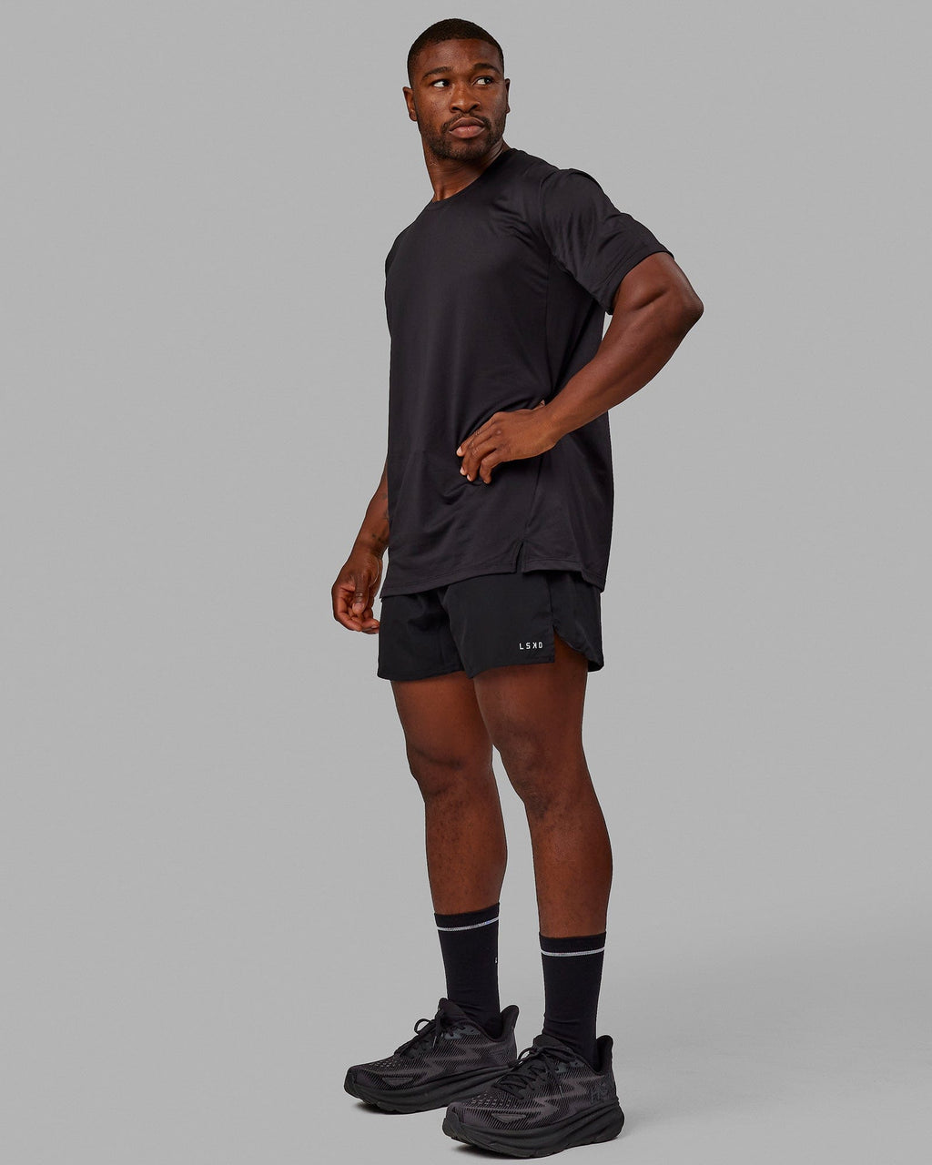 Man wearing Pace 5" Lined Performance Shorts - Black-Reflective