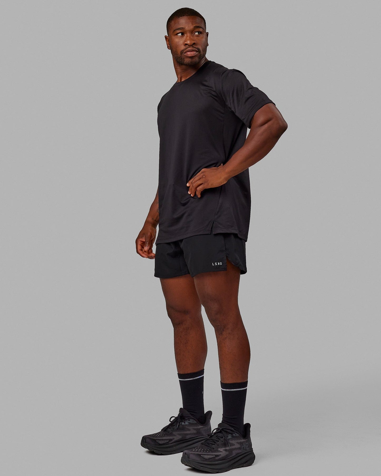Man wearing Pace 5" Lined Performance Shorts - Black-Reflective