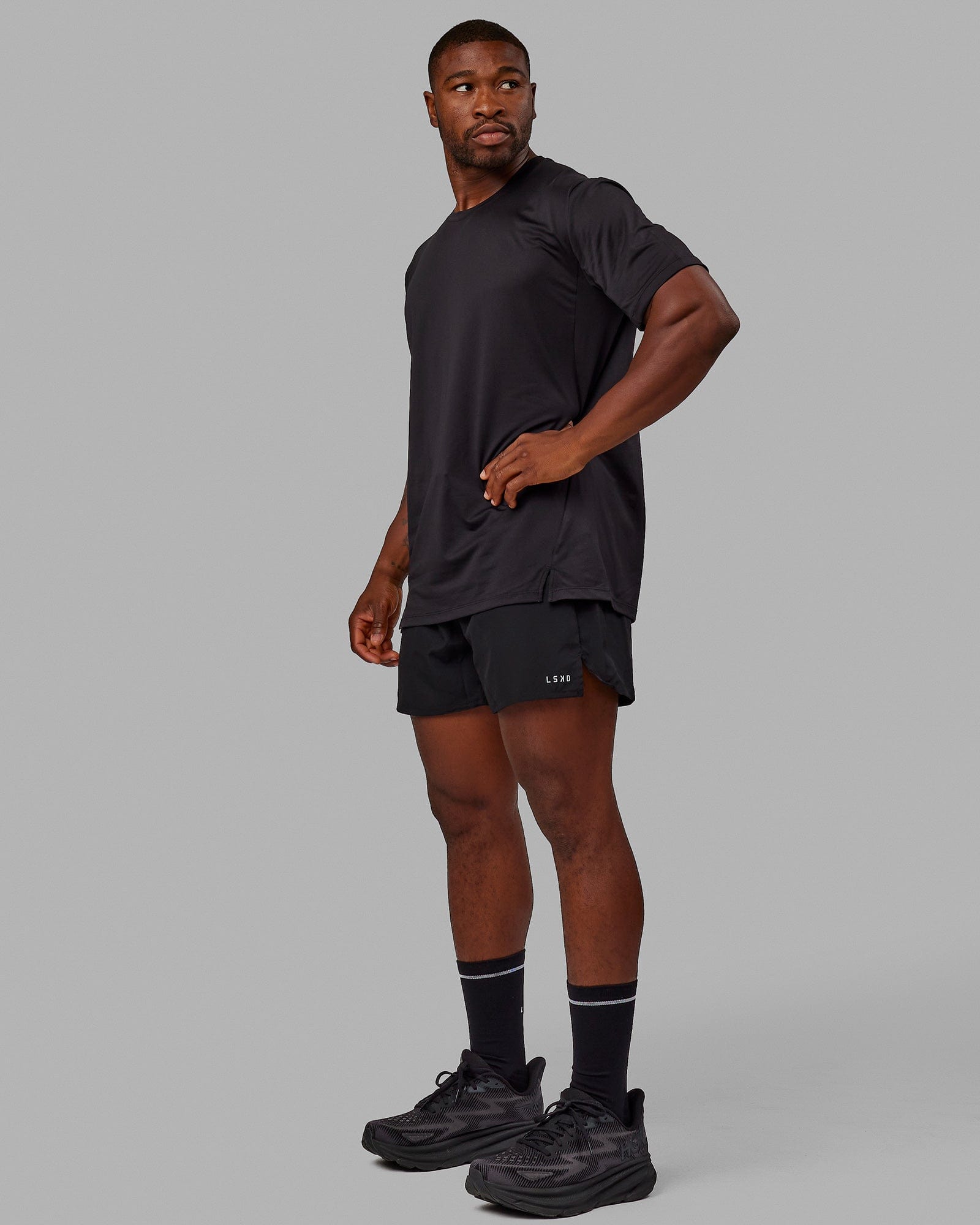 Man wearing Pace 5" Lined Performance Shorts - Black-Reflective