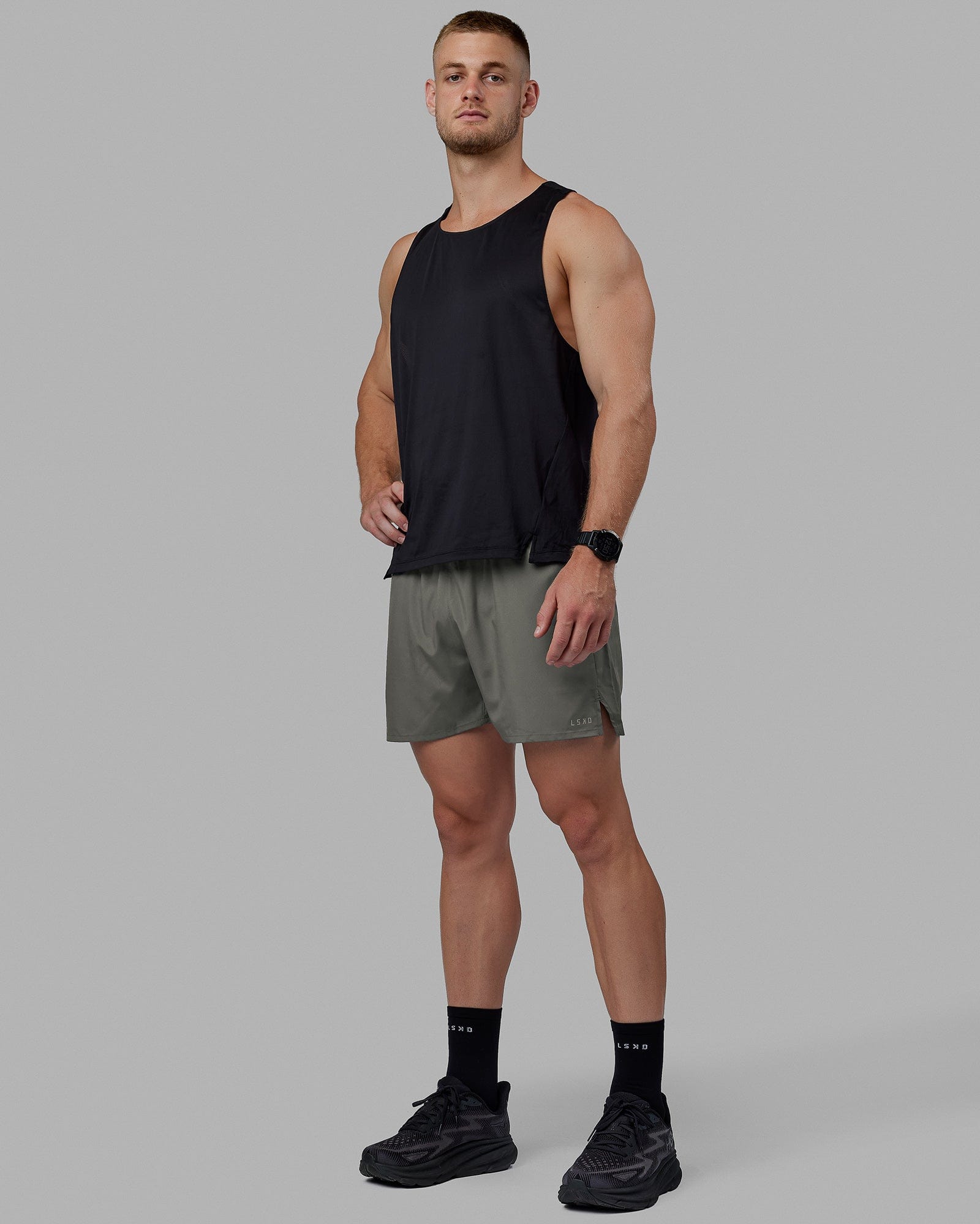 Man wearing Pace 5" Lined Performance Shorts - Graphite-Reflective