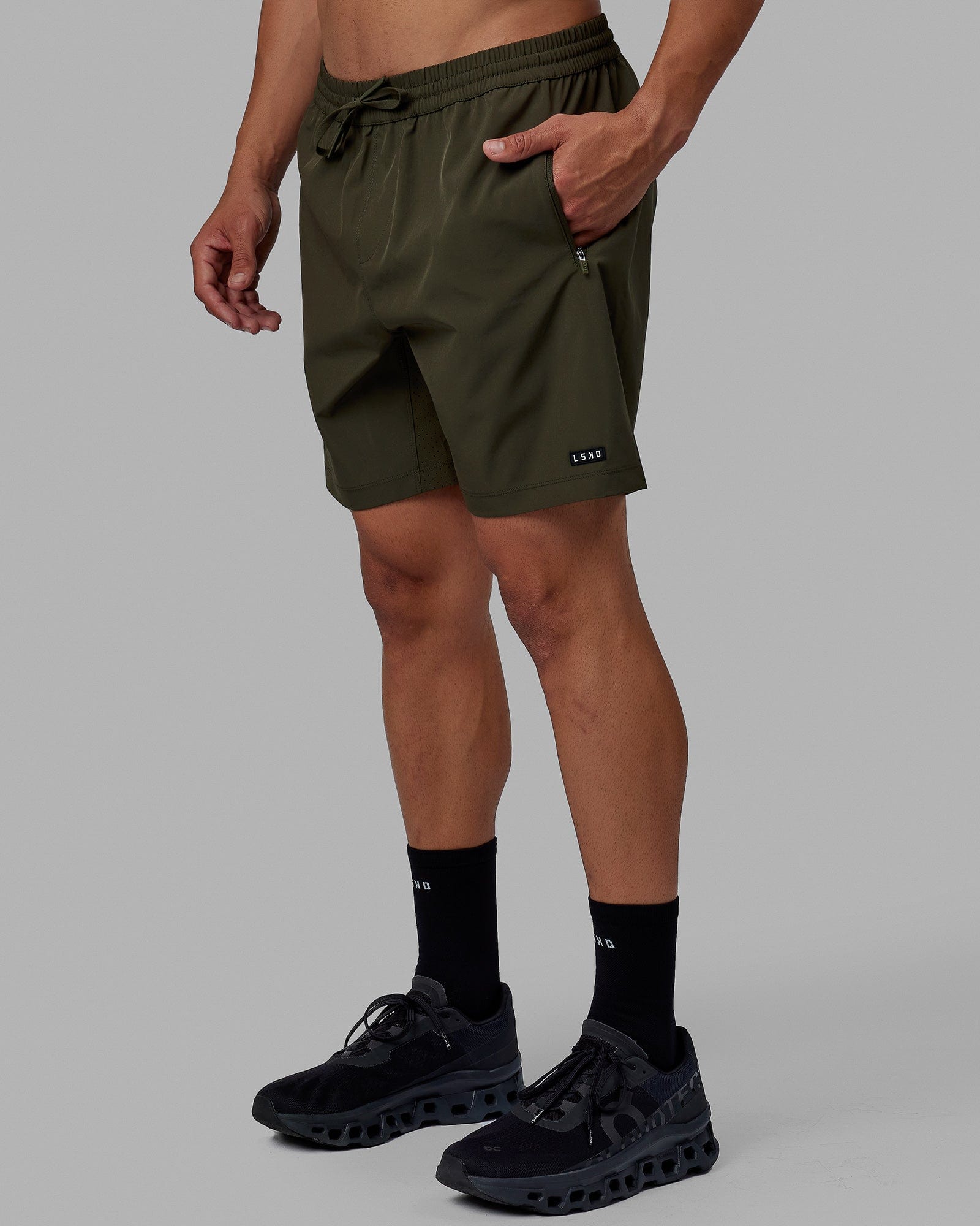 Man wearing Rep 7'' Performance Short - Forest Night