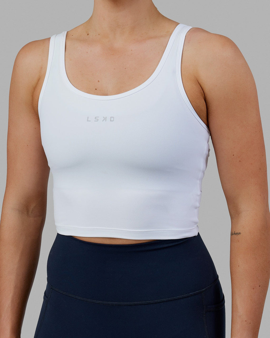 Woman wearing Staple Active Cropped Tank - White