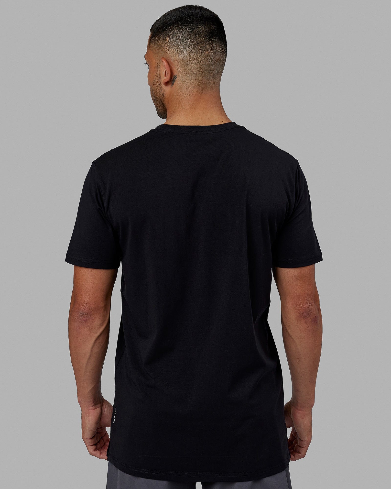 Man wearing Strength FLXCotton Tee - Black-White