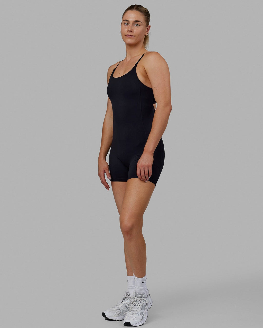 Woman wearing Twist Bodysuit - Black