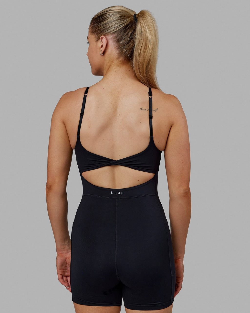 Woman wearing Twist Bodysuit - Black