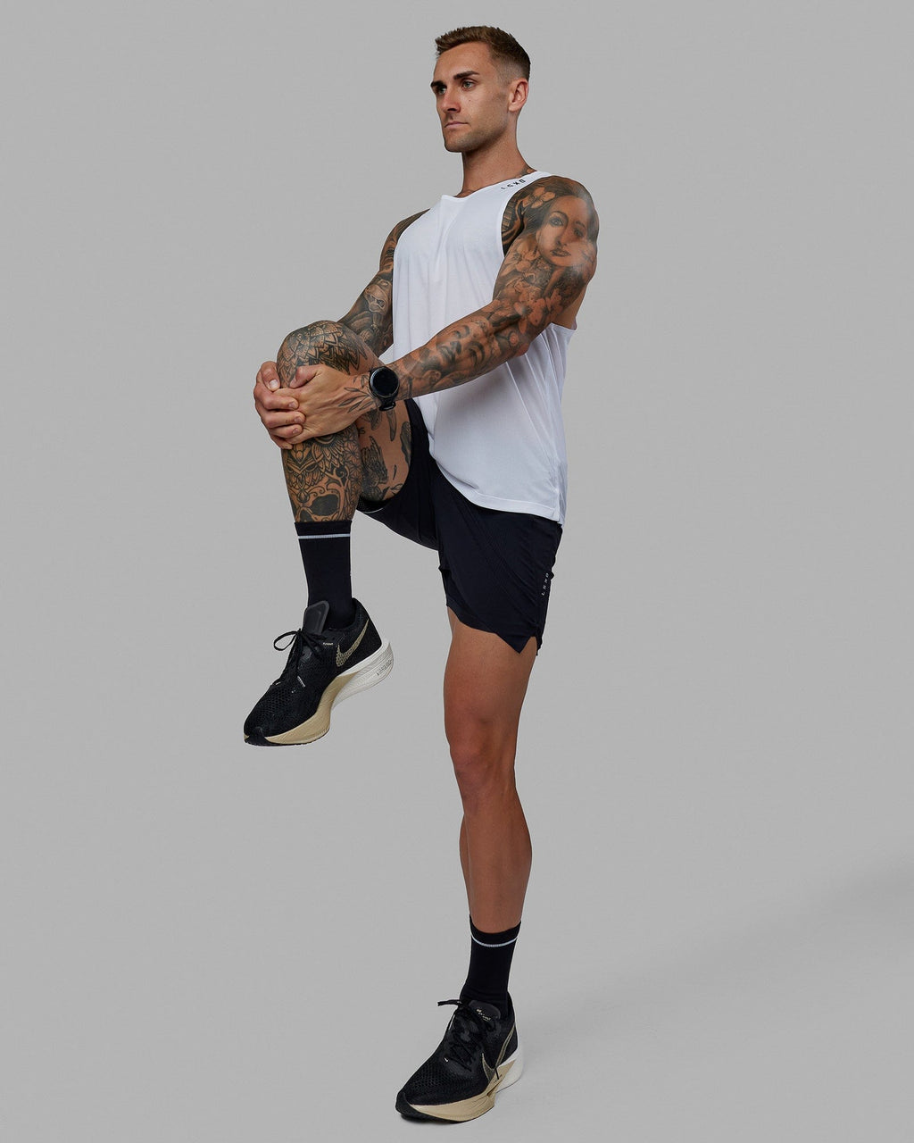 Man wearing UltraAir 5" Lined Performance Short - Black-Reflective